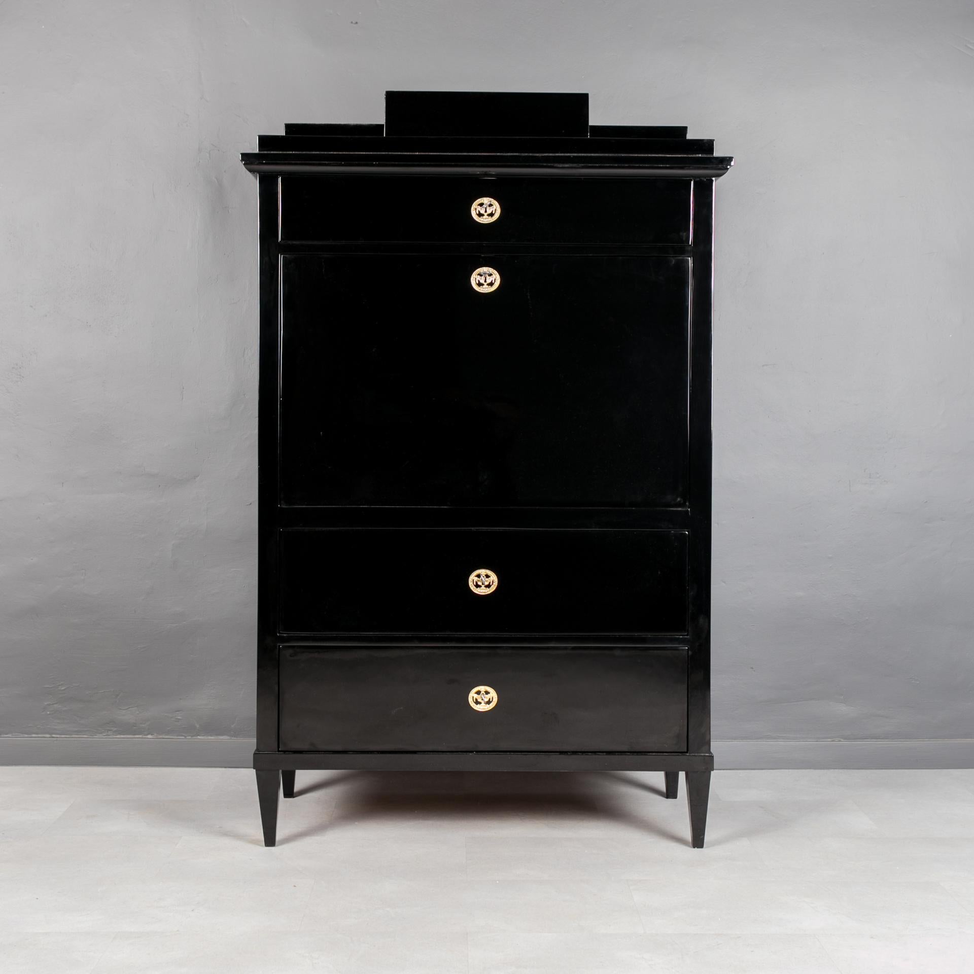 This Biedermeier secretary comes from Austria and was made in 19th century. It is made of coniferous wood, veneered with cherrywood. It has undergone a professional renovation process. Surface finished with black shellac polish applied by hand with