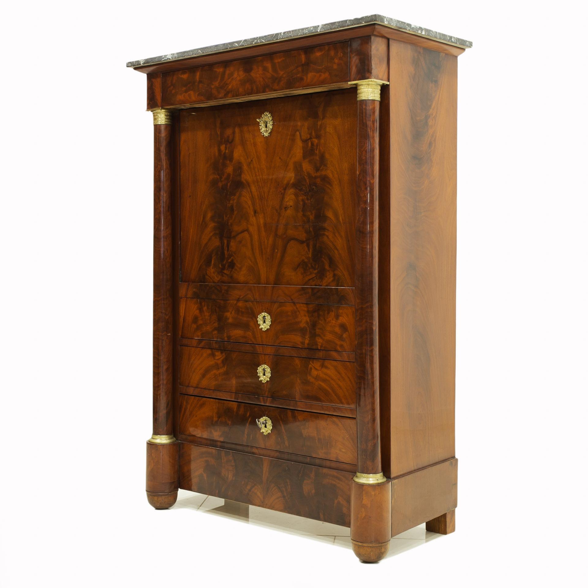 This Biedermeier secretary comes from France and was constructed in 19th century. It is made of oak wood, veneered with pyramidal mahogany All brass fittings are original. It features marble top. The piece is equipped with three drawers at the