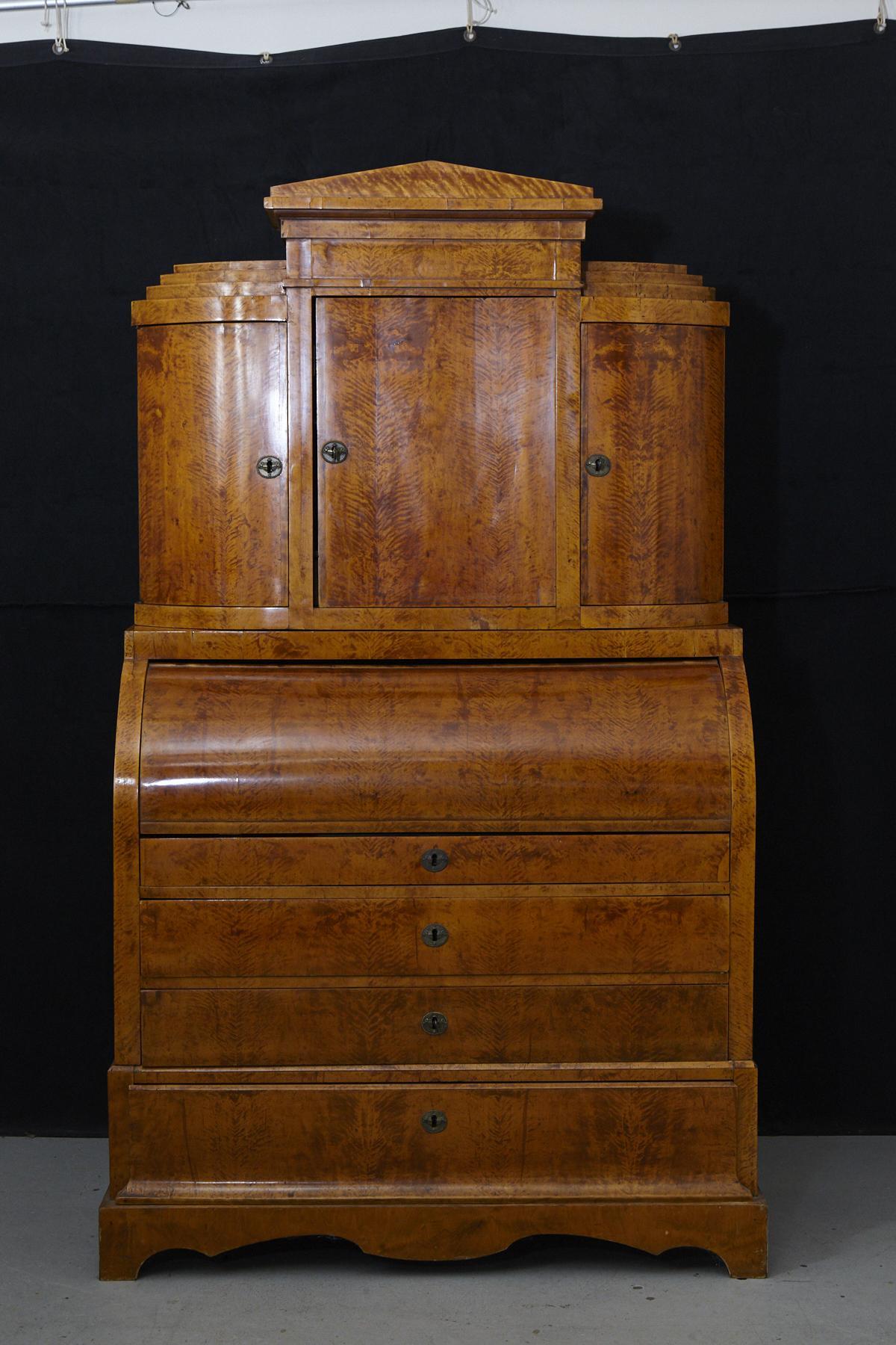 Stunning example of a Biedermeier secretary. There is some missing veneer on the front and both sides, part of the upper right-hand rail is loose, needs some repair. The item is refinished.
 