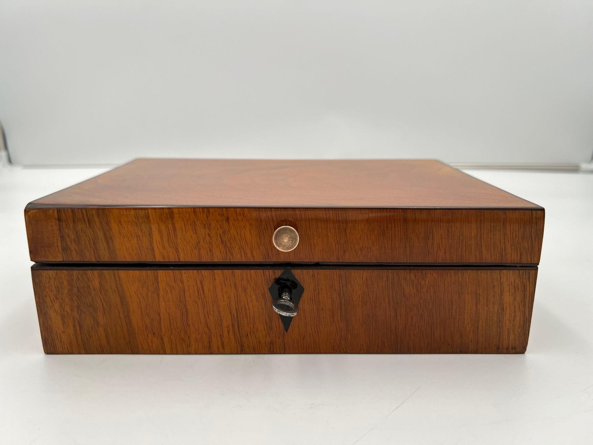 Beautiful original antique Biedermeier Sewing Box in Walnut Veneer from Austria circa 1820.
Walnut veneered. Ebony inlays. Brass button. Inside with complete original sewing equipment.
Mirror on the top inside. Restored and hand polished with
