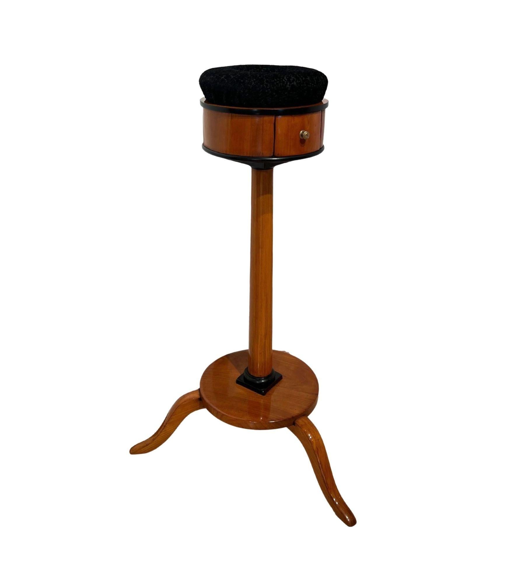 Biedermeier Sewing Stand, Cherry Wood, South Germany circa 1825

Rare, very fine Biedermeier sewing stand. Cherry wood veneered and solid, hand polished with shellac. Round pincushion with new black structured velvet fabric. Small drawer on the