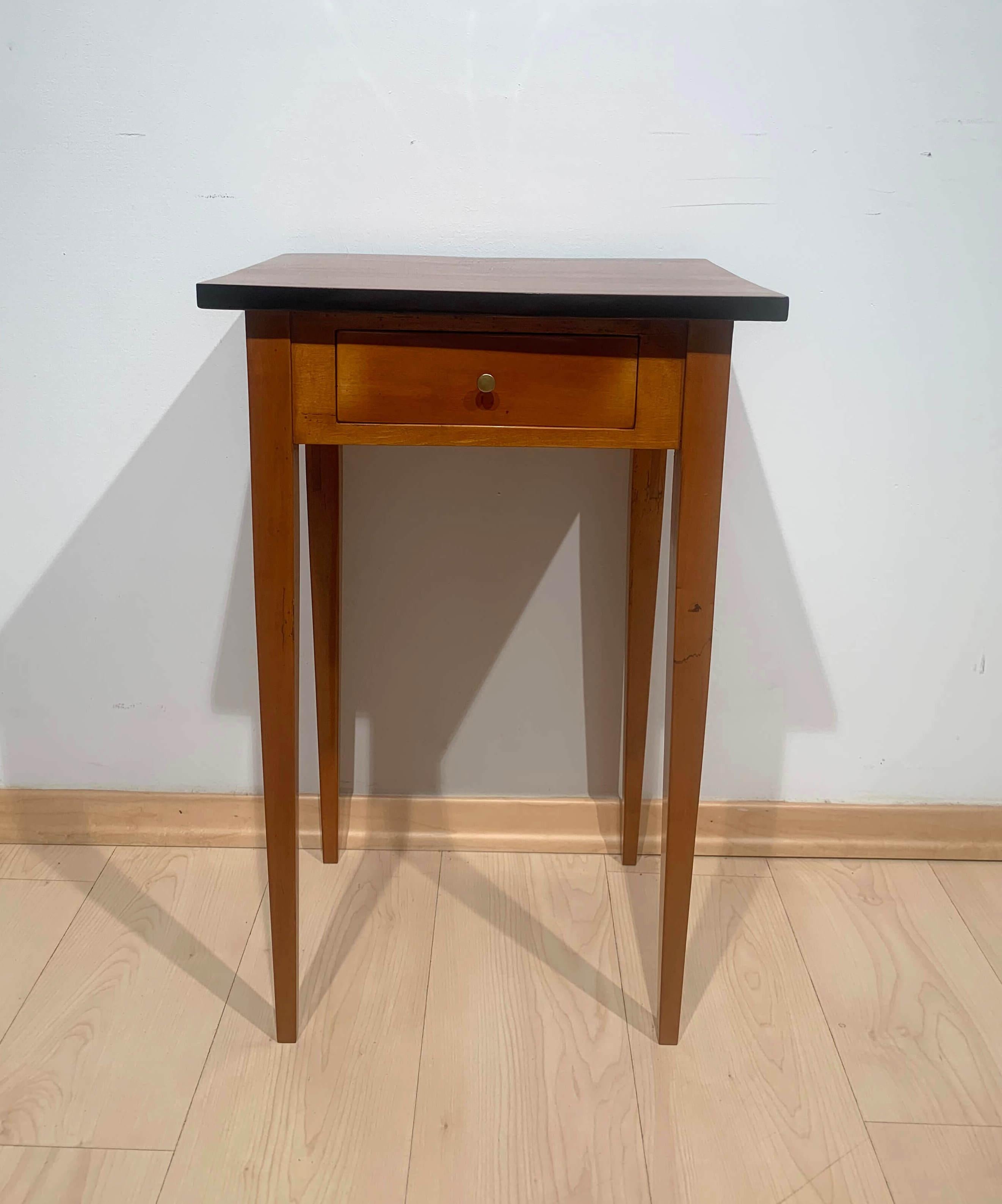 Biedermeier side table with drawer, cherry wood, South Germany circa 1830

Small, plain Biedermeier side table with drawer from South Germany around 1830.
Cherry veneered on softwood and solid beech. Restored with french polished surface.