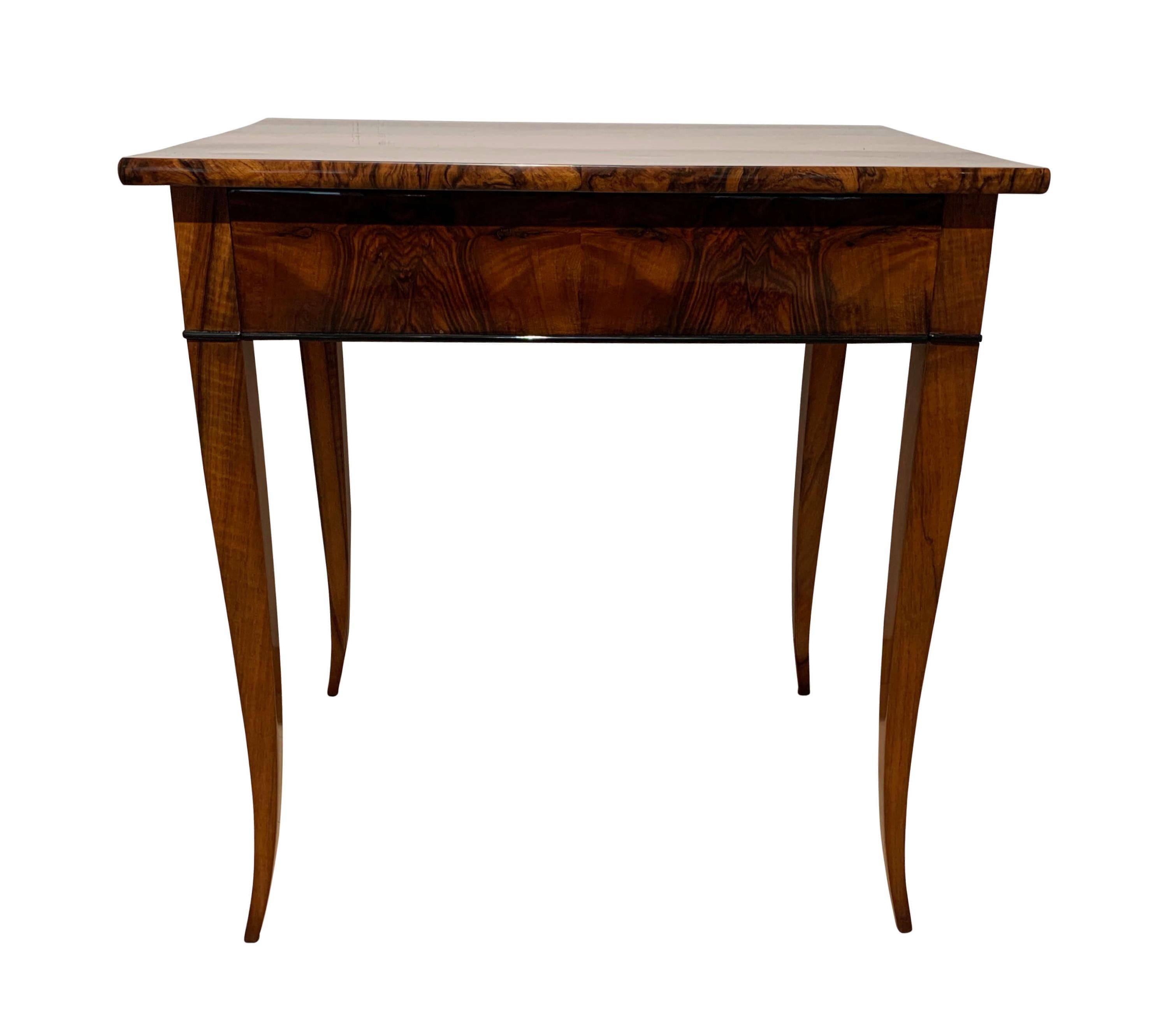 Very elegant, early Biedermeier side table / writing table with drawer from South Germany circa 1820

Walnut veneered at the plate and apron and legs made of walnut solid wood.
Shellac hand-polished (French Polished) and partly ebonized.
Elegantly