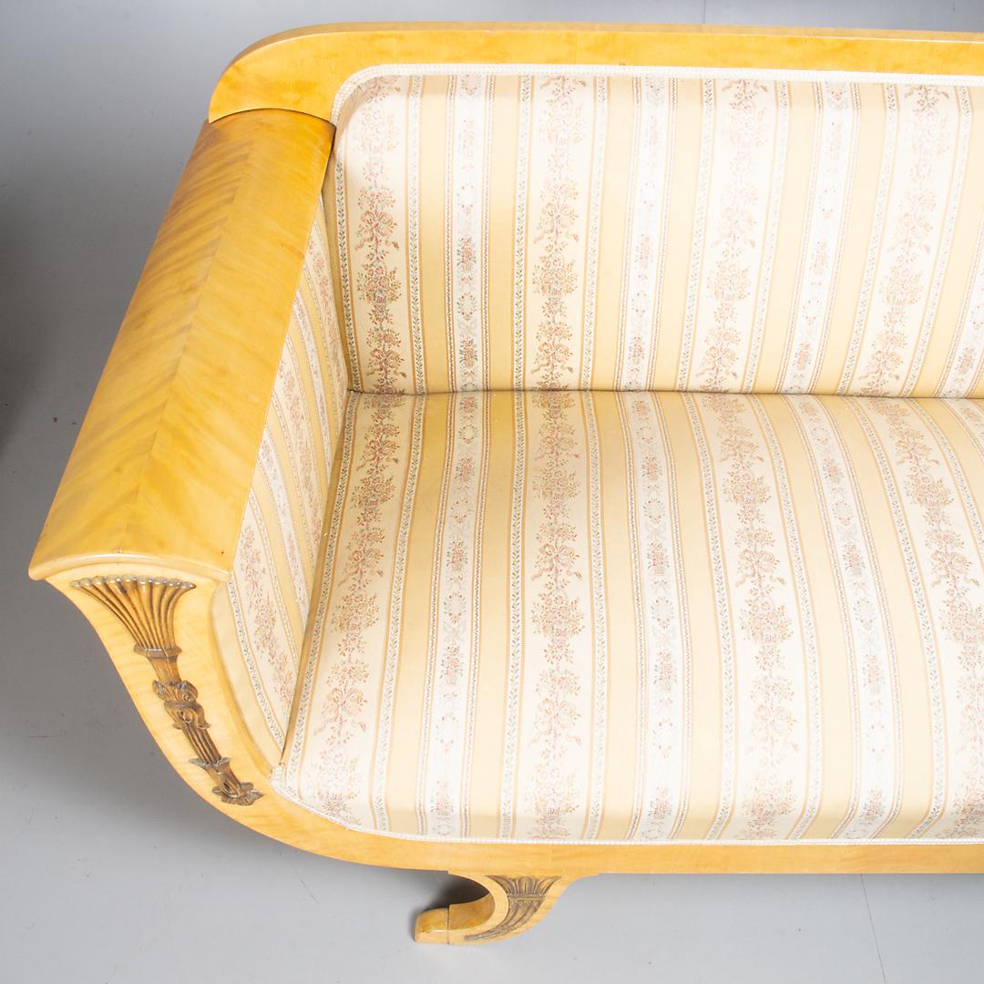 Swedish Biedermeier 3-4 seat sofa couch in beautiful light honey color French polish finish with curved arm detailing and carved applique decorative motifs in the highest quality quilted golden birch veneers.

Good example of the Swedish