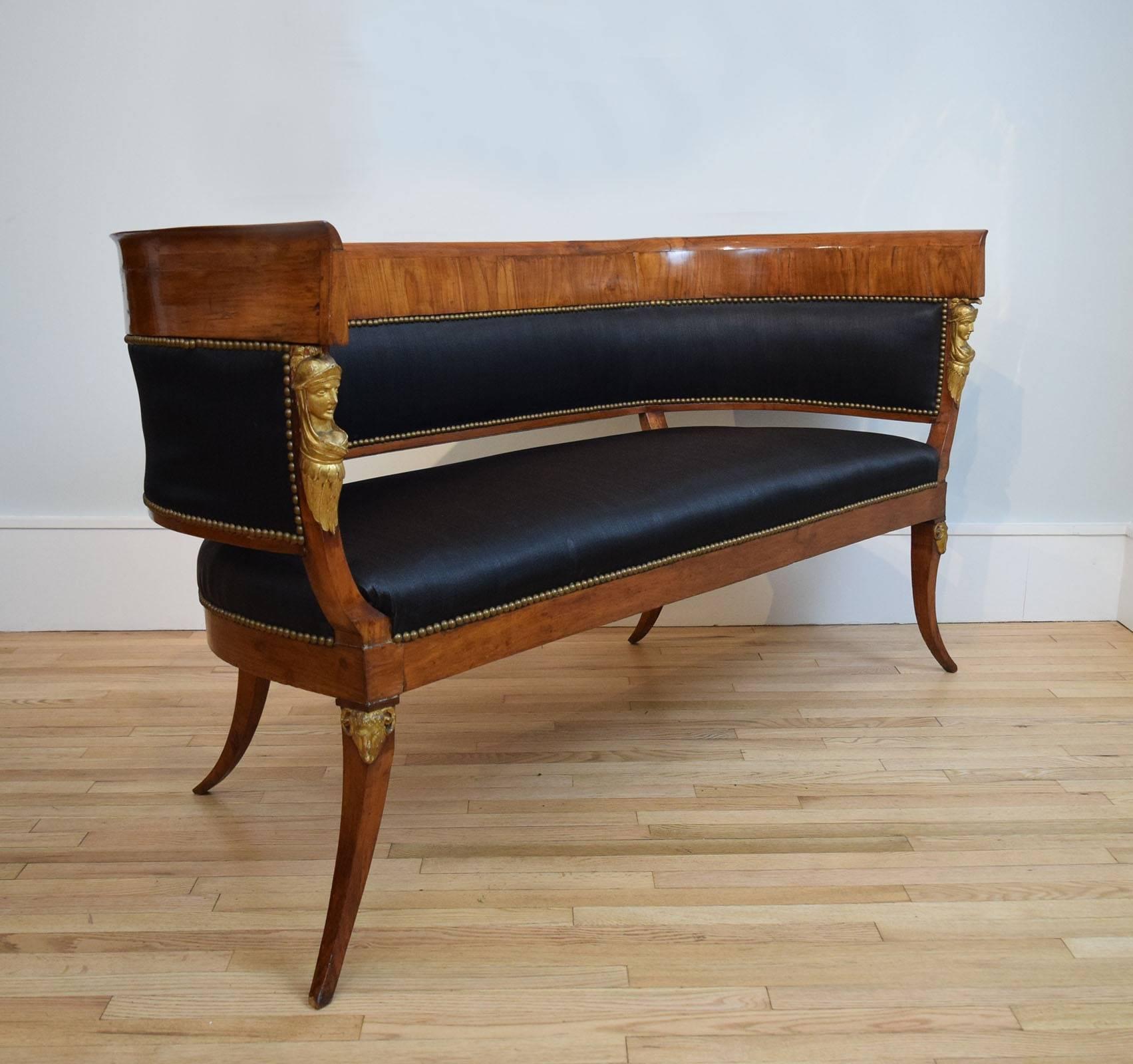 This sculptural sofa, of solid and veneered walnut, has exquisite lines and was in the collection of Millicent Rogers, a Standard Oil heiress who had one of the most remarkable eyes of the last century. A collector and a designer of jewelry, she was