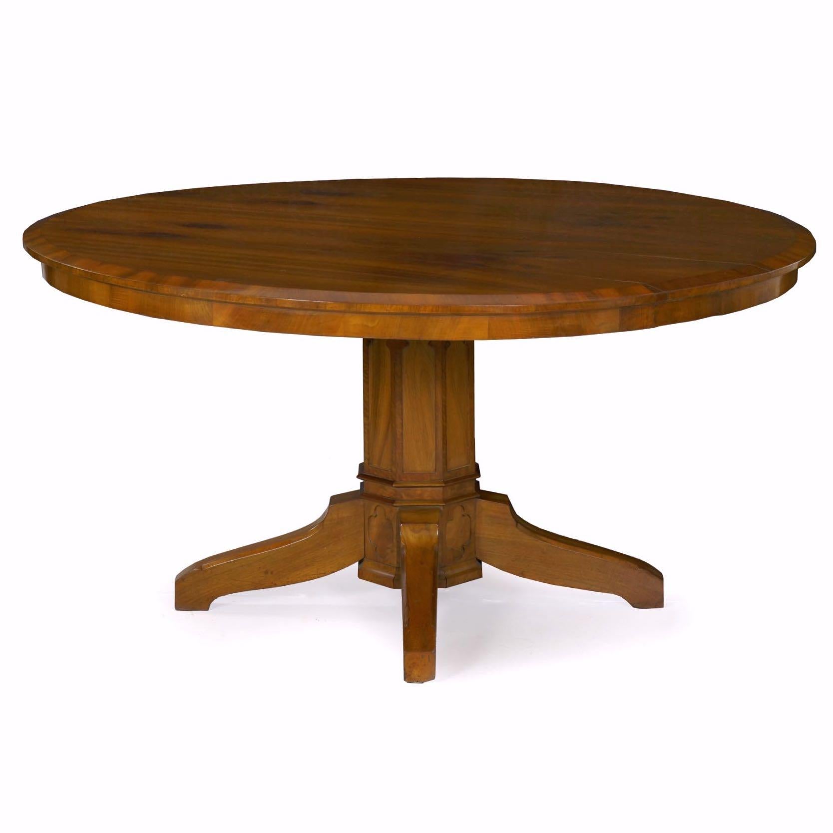 An attractive center table crafted in the austere Biedermeier taste, probably during the last quarter of the 19th century, the top is veneered in figured walnut. The edge is beveled and projects slightly over a thin apron. To allow the piece to