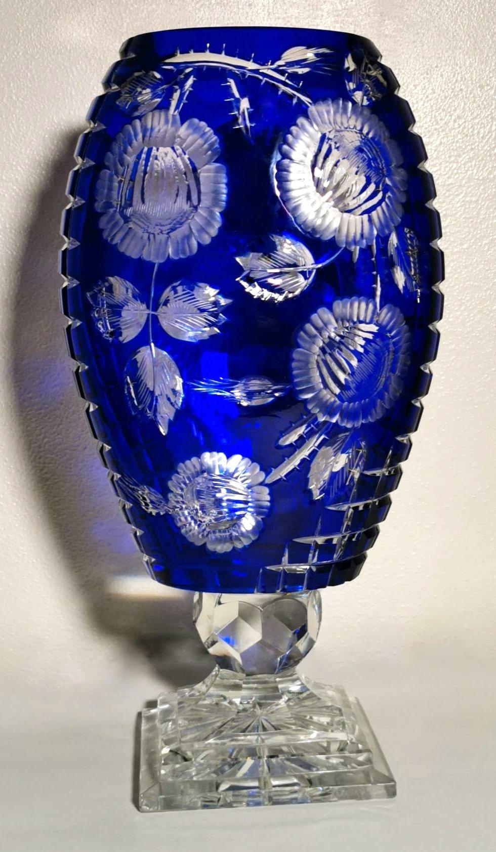 Large and spectacular blue crystal vase; made between 1947 and 1950 in northern Bohemia in the Jablonec nad Nisou area, in one of the many artisan workshops of the place where the processing, blowing, manipulation, carving, and decoration of glass