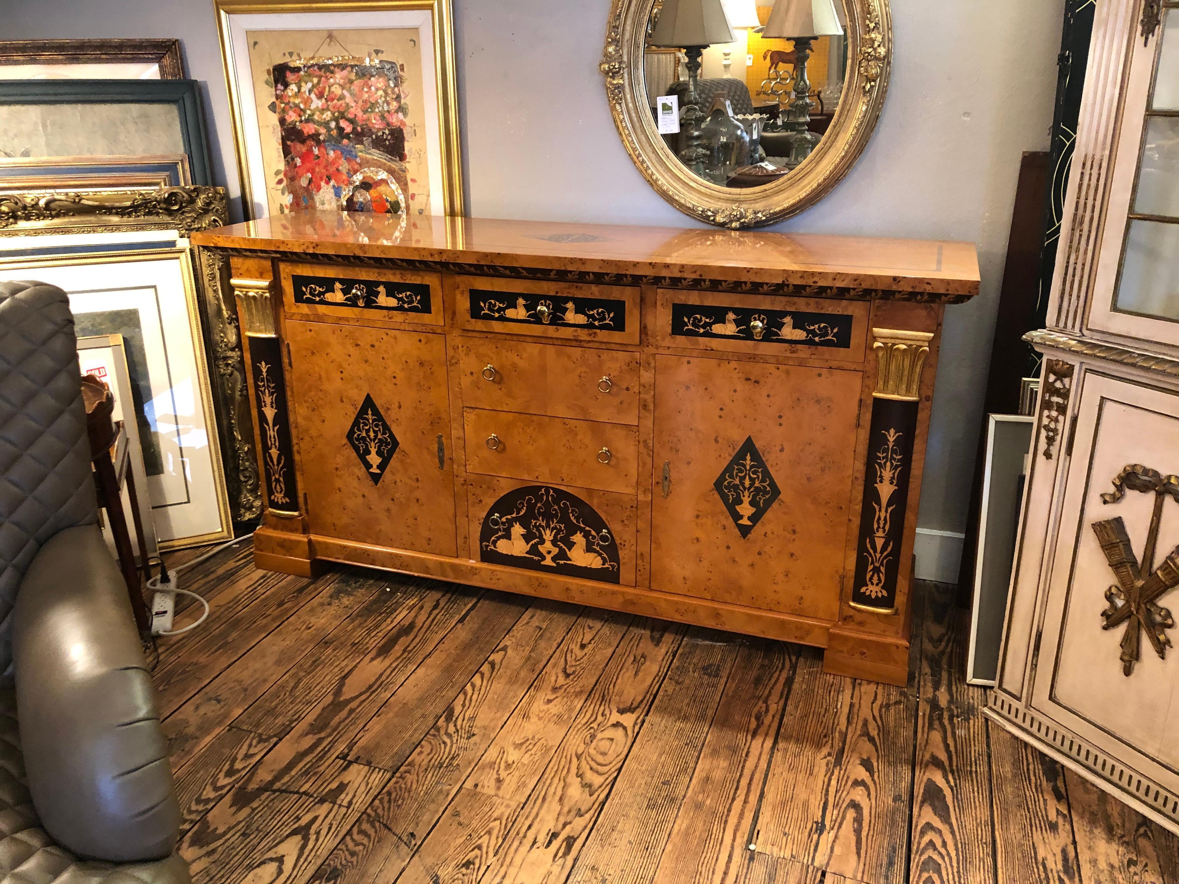 Francesco Molon ornately inlaid Italian neoclassical style or Empire credenza buffet cabinet. The mix of blonde honey colored burled wood and ebonized inlay is reminiscent of Biedermeier. The company was established over forty years ago in Romano