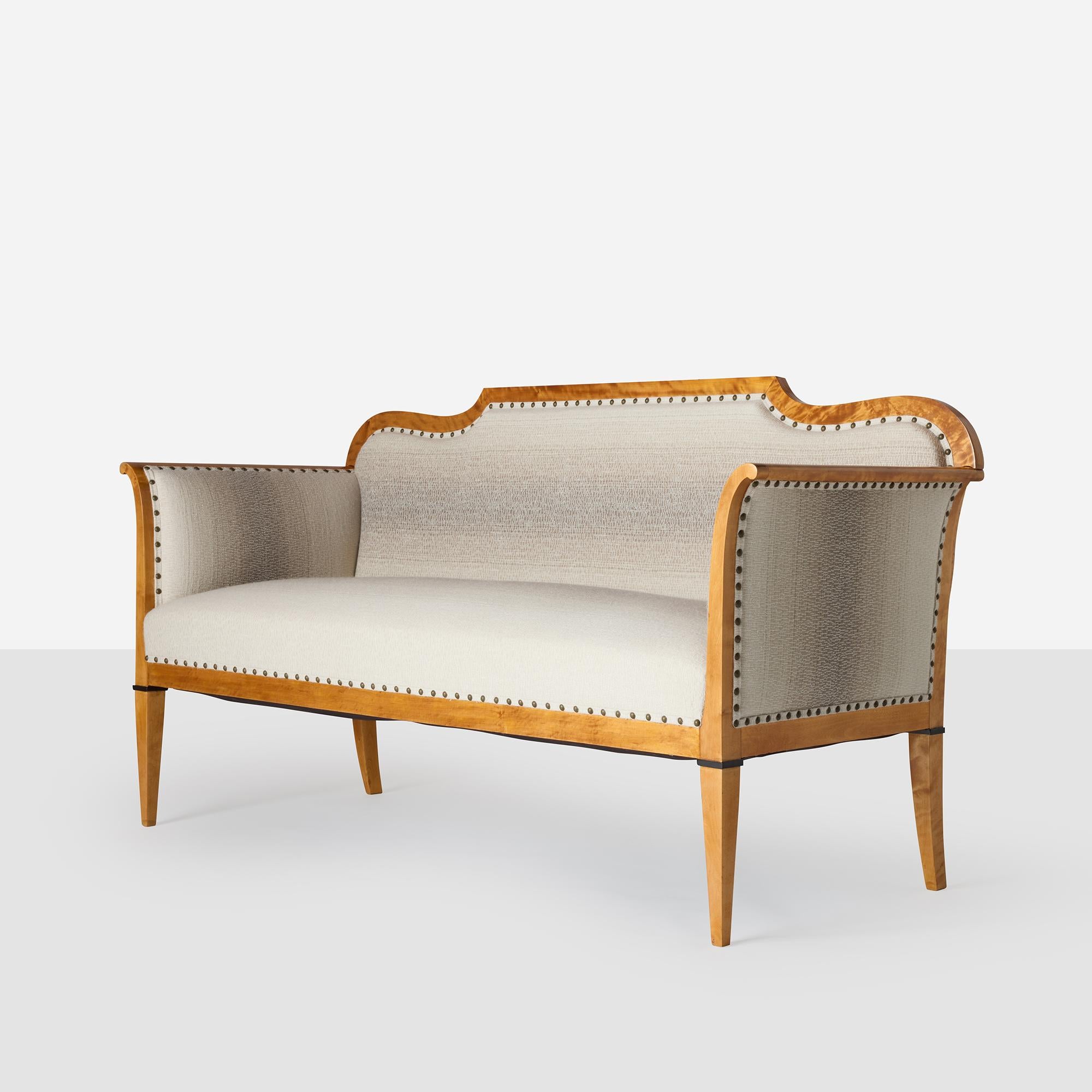 Biedermeier Style Settee in Prima Alpaca

A 19th century Biedermeier style tightback settee with gently curved back, tapered legs, and decorative nailhead trim. The light-toned wood frame, has been expertly restored and upholstered in Sandra