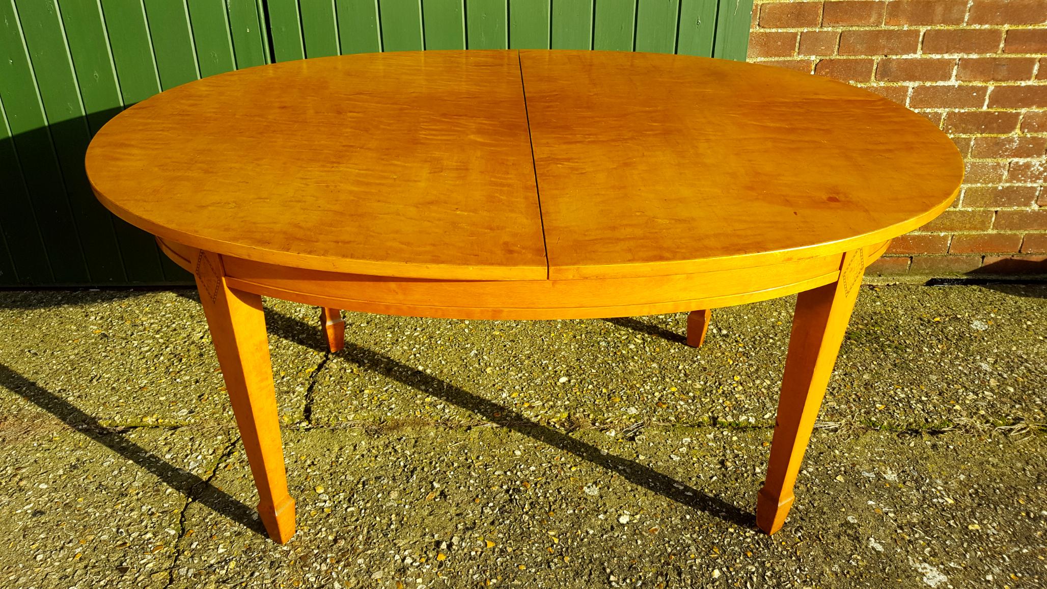 Very unusual Biedermeier style 254cm dining table in a highly French polished finish with intricate inlaid marquetry detail on the legs.

It has 3 leafs of 33cm and reduces to about 157cm without the leaves - with these original Swedish tables the