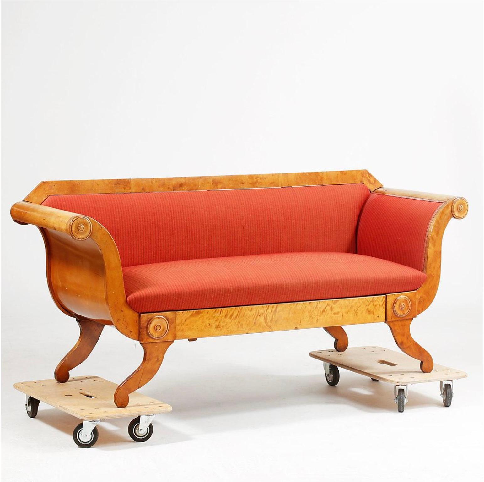 Swedish Biedermeier 3-4 seat sofa couch in beautiful light honey color French polish finish with curved arm detailing and carved applique roundel decorative motifs in the highest quality quilted golden birch veneers. 

Good example of the Swedish