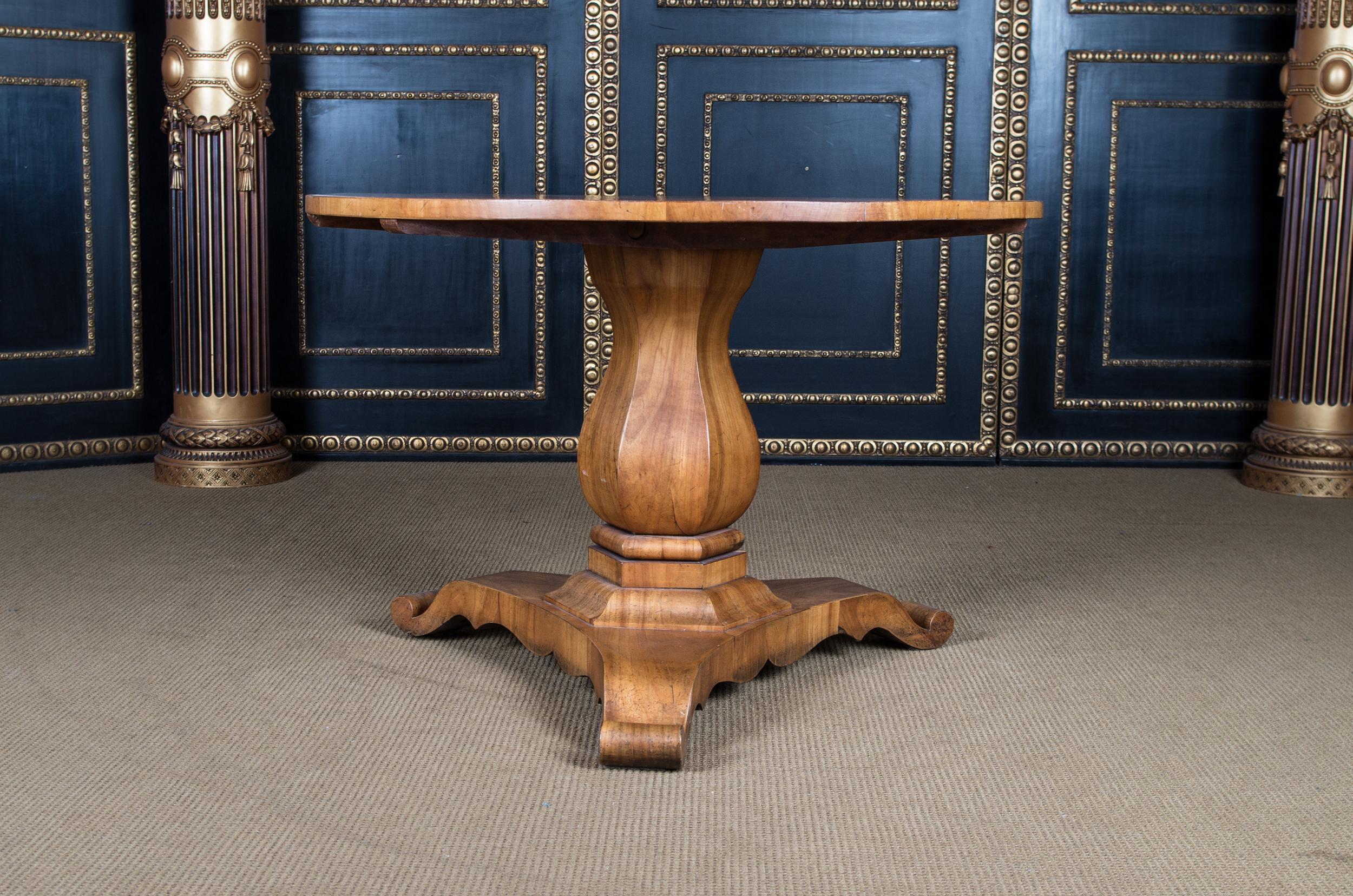 Solid cherrywood and veneered. Inclined, column shaft, flanked by three curly volutes. A strict form of the early Biedermeier period. It is built with a folding mechanism. This type is very practical, not only because it saves space, but because it
