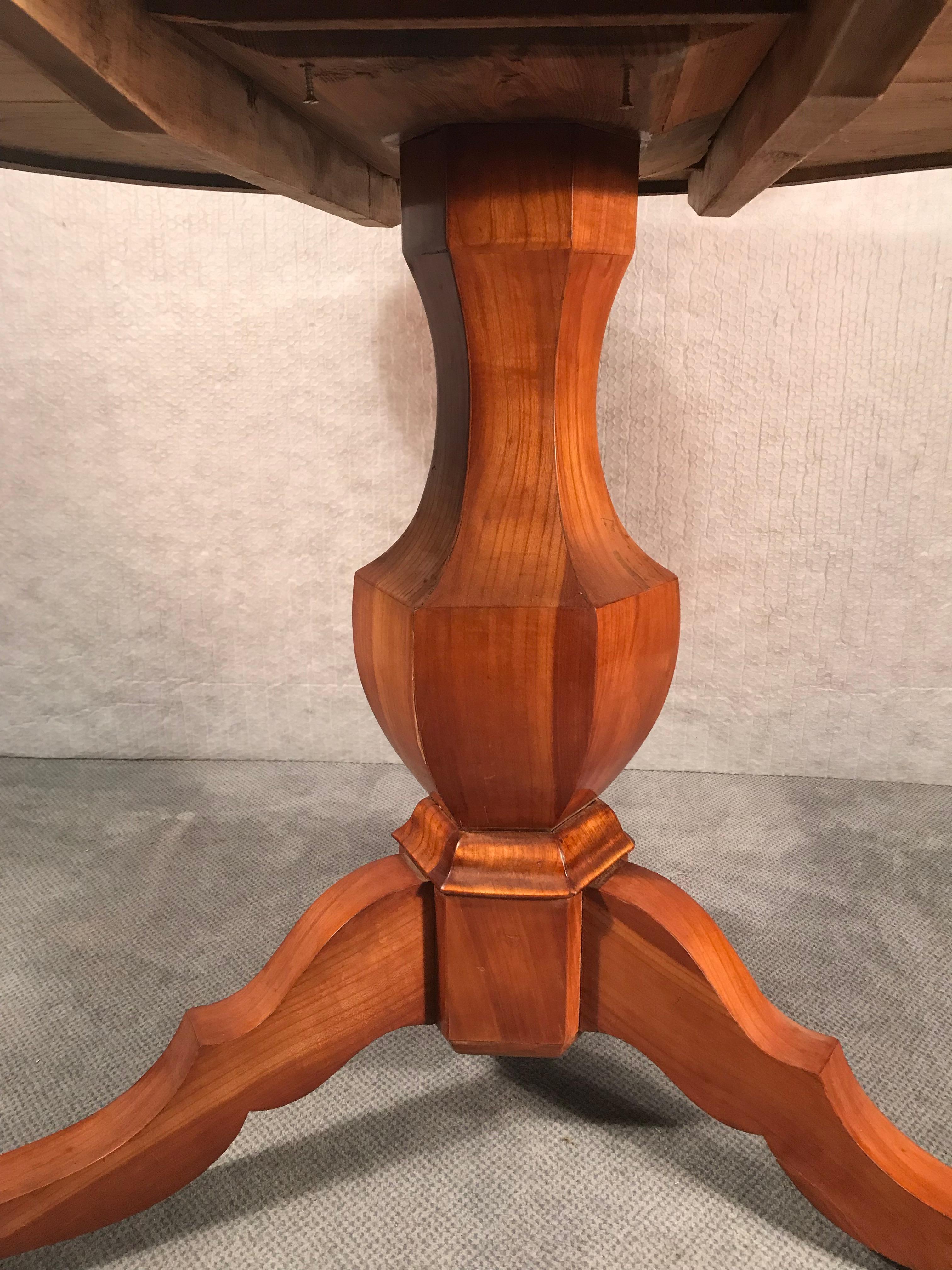 Biedermeier table, South German 1830, cherrywood veneer. The table is in good, refinished condition, French polished.