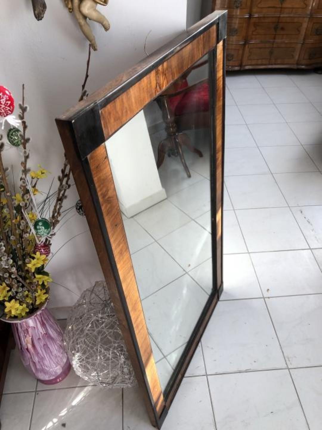 Original Biedermeier mirror with a beautiful walnut veneered frame. Convinces with its beautiful burl grain and the warm color of the wood.
authentic piece from circa 1865 from Austria. Features hangers on the backside for easy installation.