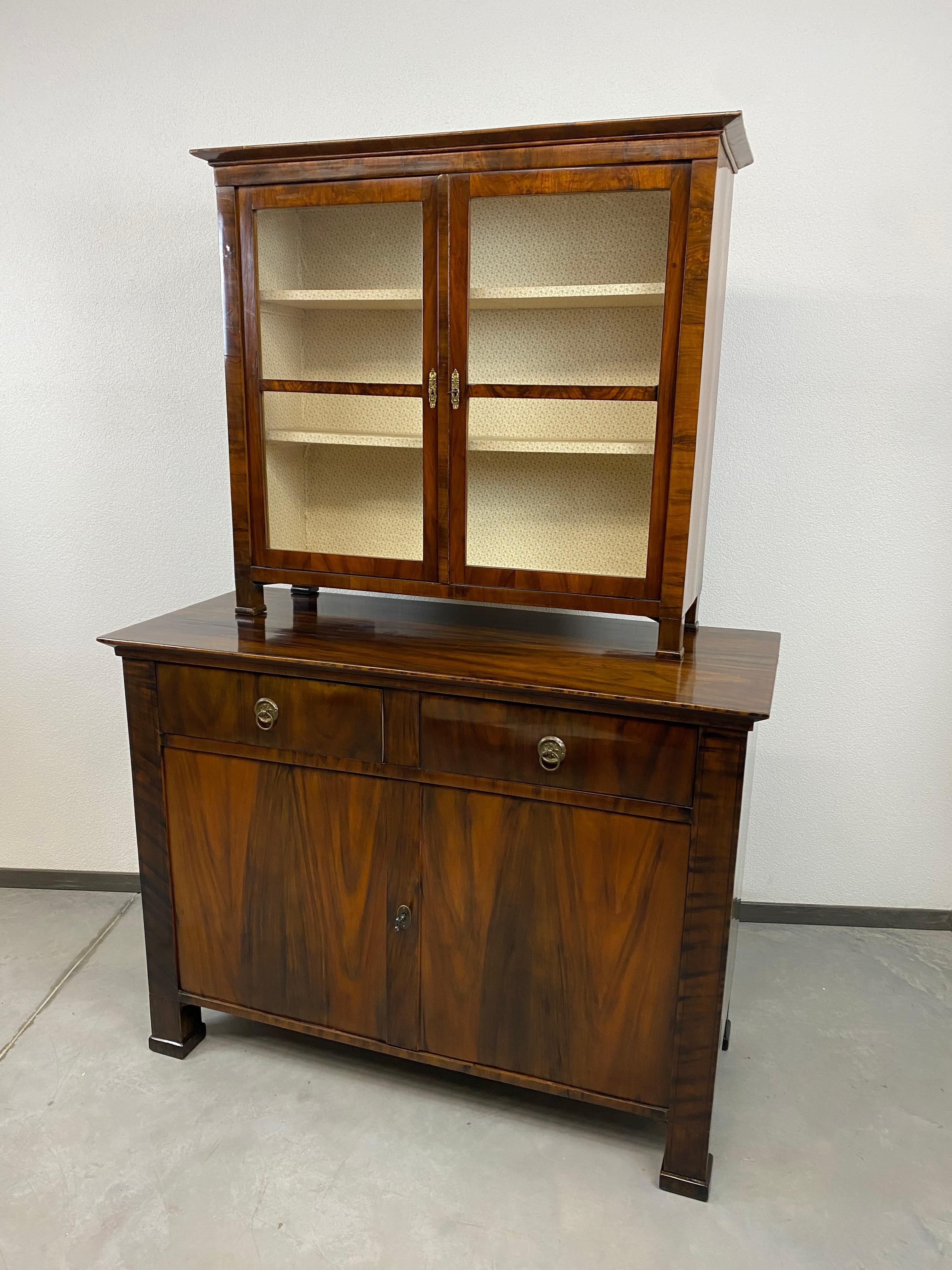 Fine biedermeier walnut cabinet in very good original condition with signs of usage.