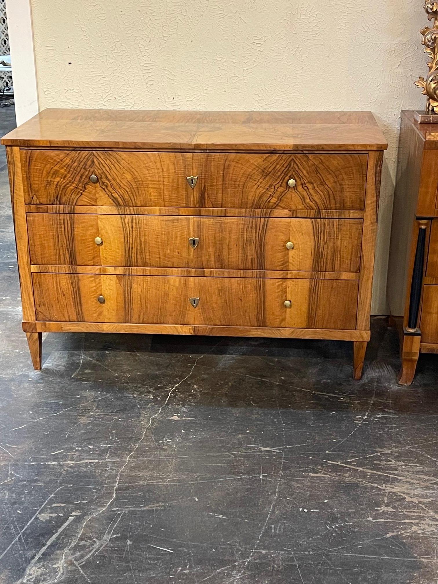 19th century Biedermeier walnut commode, Circa 1885. The is a very handsome commode with beautiful wood grain and polish. Perfect for any space.