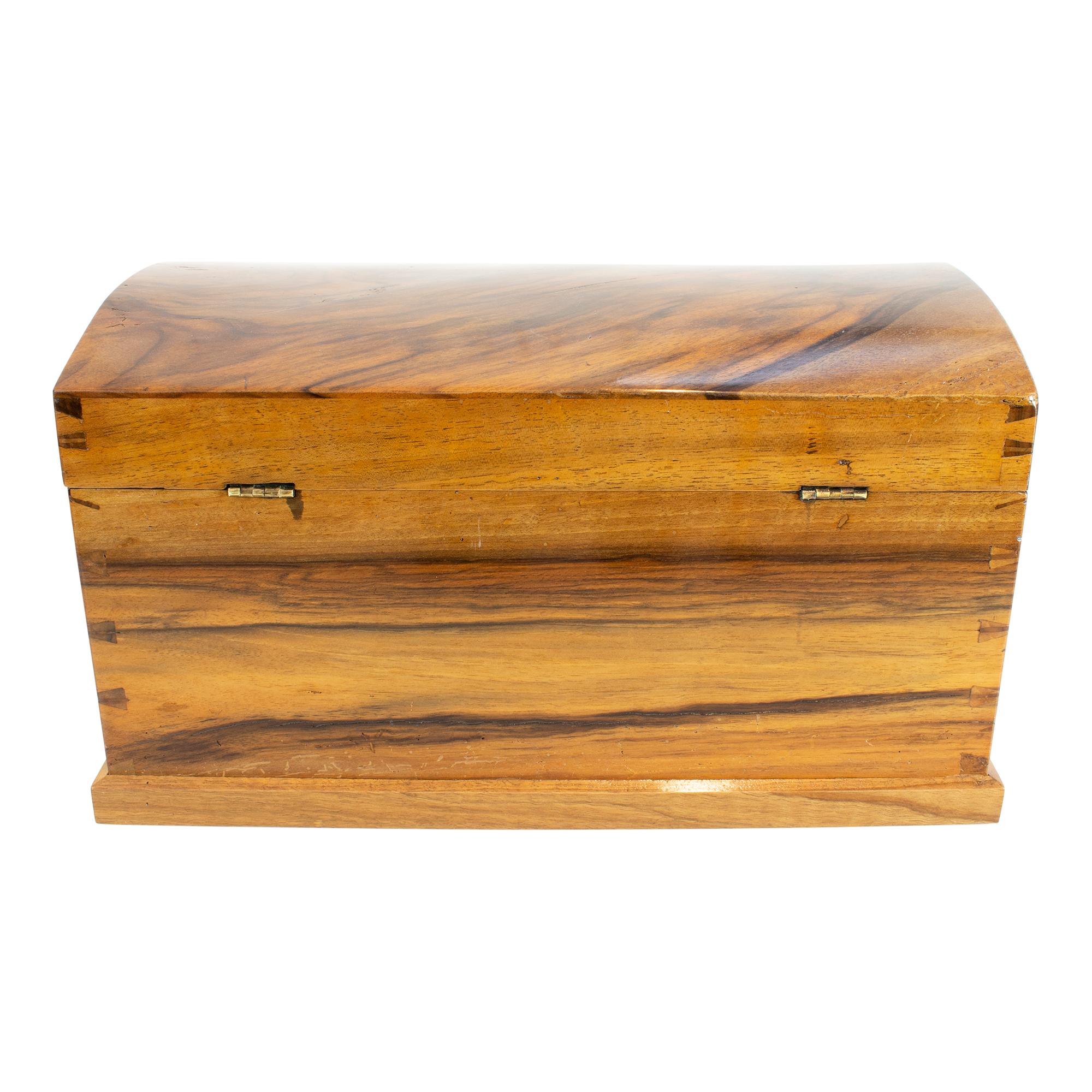 The miniature chest was made of walnut and dates back to the early Biedermeier period at the beginning of the 19th century. A very nice small rare furniture. The bottom of the chest is spruce, the rest is solid walnut. The lock of the chest has been