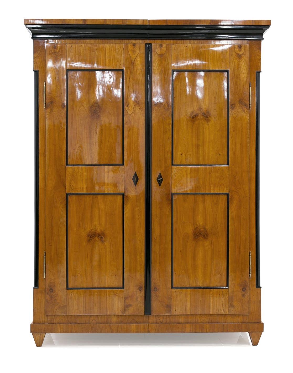 This Biedermeier wardrobe was made circa 1820 in Germany. The piece was subjected to a professional and careful renovation. The wardrobe is finished with hand-applied polishes.
It is made of solid wood, veneered with cherrywood. The construction is