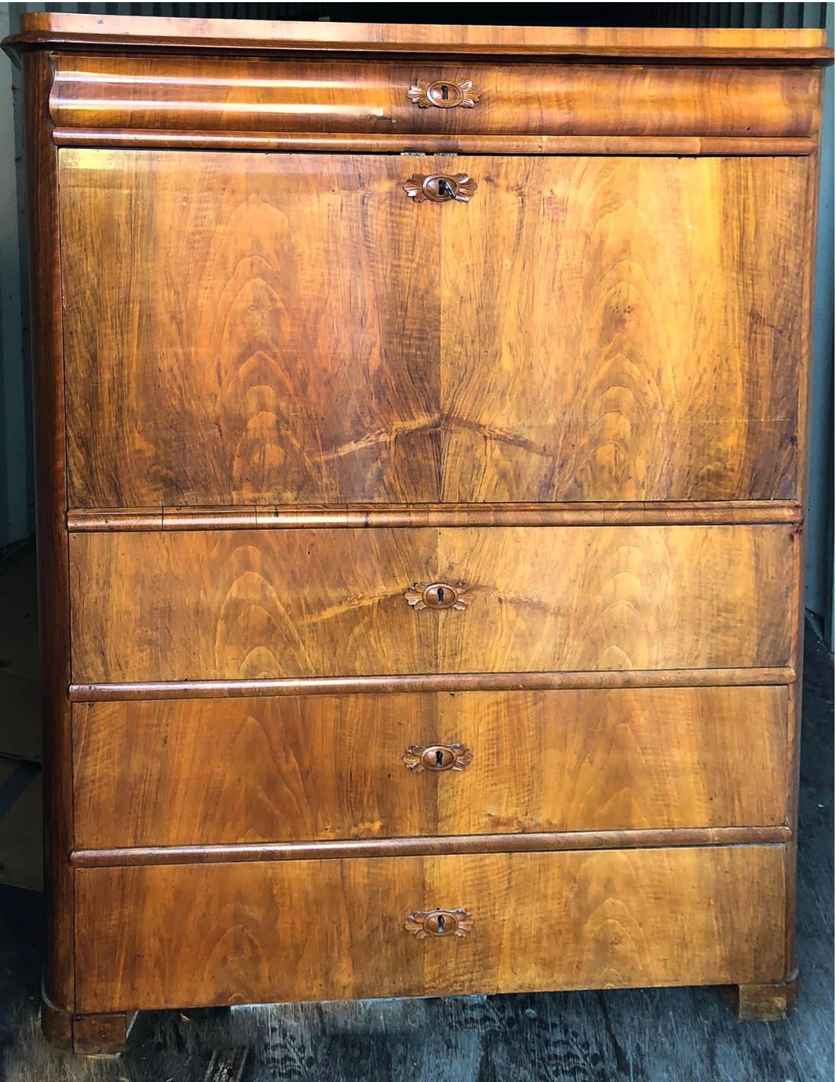 Swedish antique Biedermeier writing desk chiffonier secrétaire cabinet in highly quilted golden birch veneers and finished in the Classic light honey color French polish.

It has three main drawers, 11 small upper drawers, one upper long drawer, one