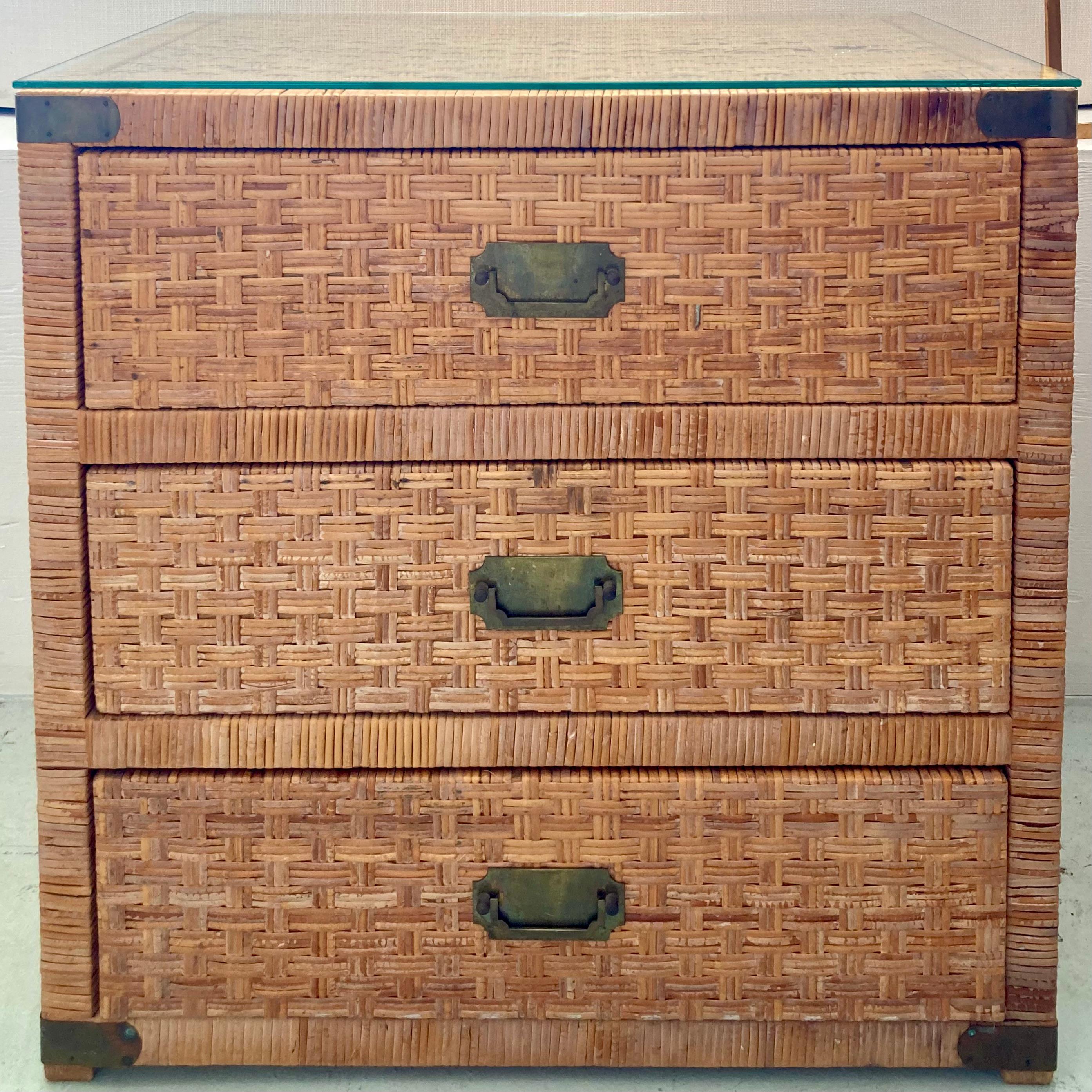 Gorgeous Bielecky Brothers rattan chest designed by Billy Baldwin. This is a timeless classic rattan chest with nice brass hardware. There are a few rattan breaks on the top and the side. The glass top is new so that certainly helps disguise the top