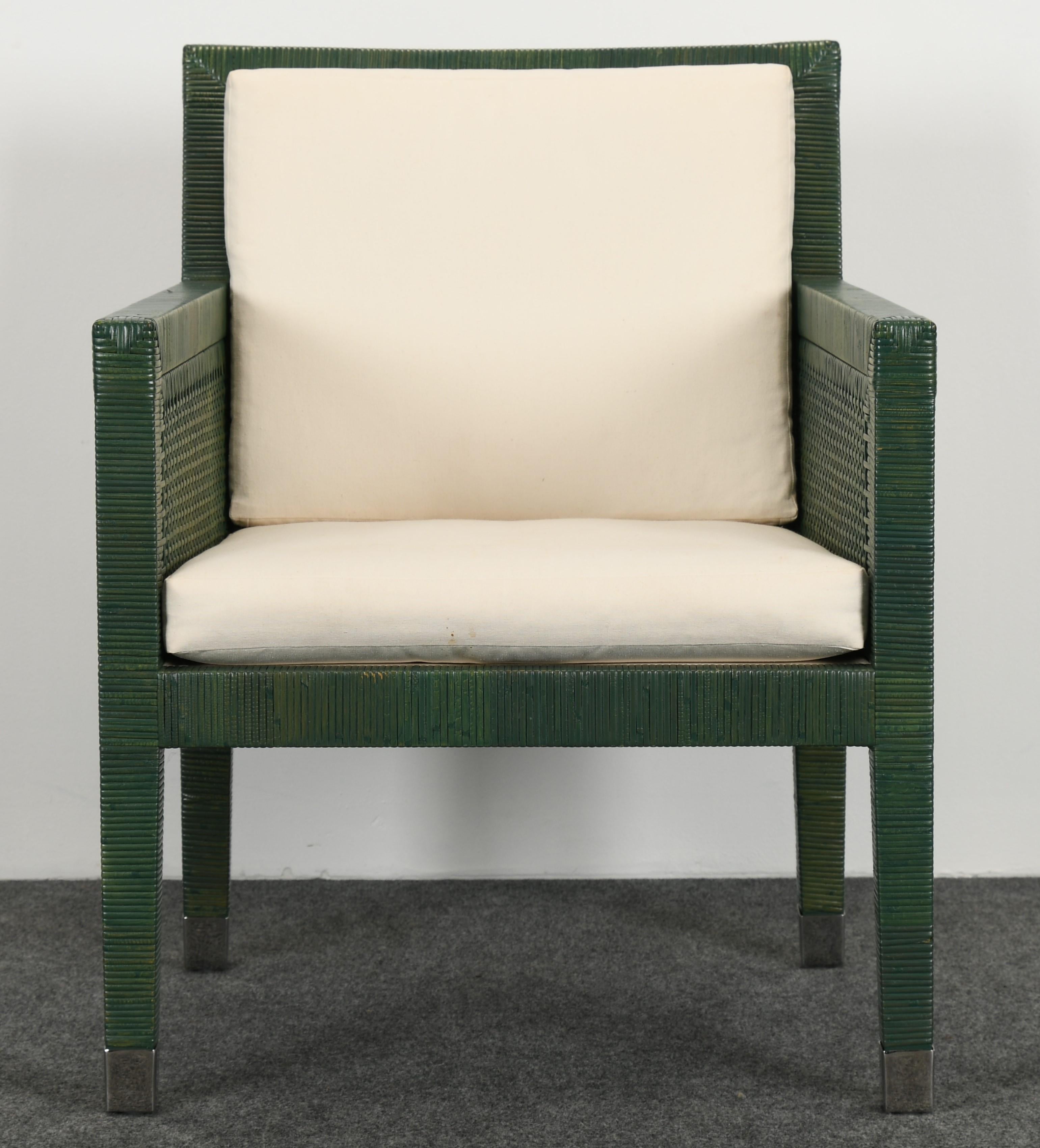 Bielecky Brothers Rattan and stainless steel armchair, 1980s. The furniture made by Bielecky Brothers is owned by celebrities and those with discerning taste around the globe. The armchair has a vintage green painted finish with capped stainless