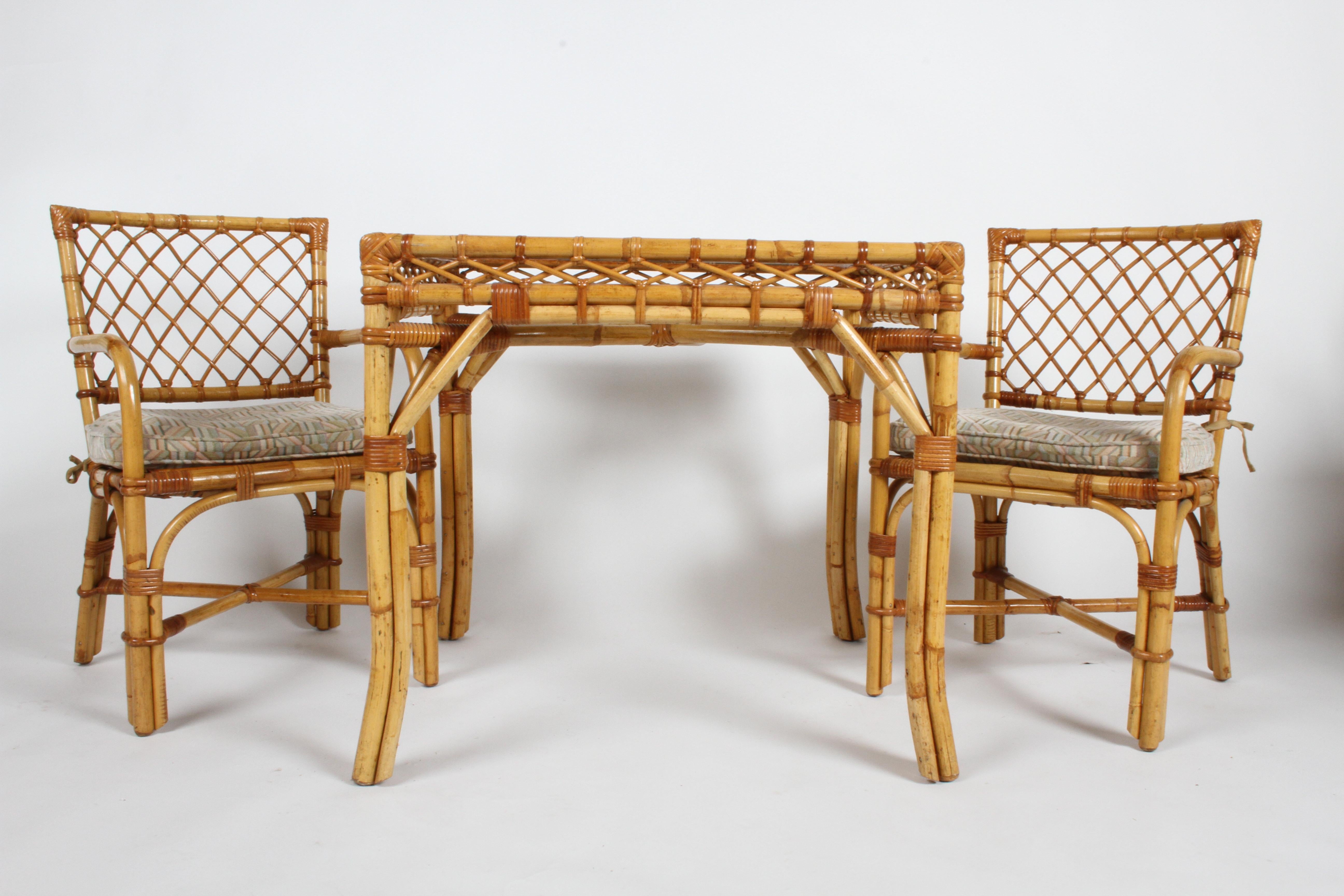 Bielecky Brothers NYC card or dining table set with textured glass top and two armchairs (model #R5319), circa 1980s. In nice vintage condition, minor wear to rattan, glass appears free of chips. Older upholstered seats should be updated. Nice set,