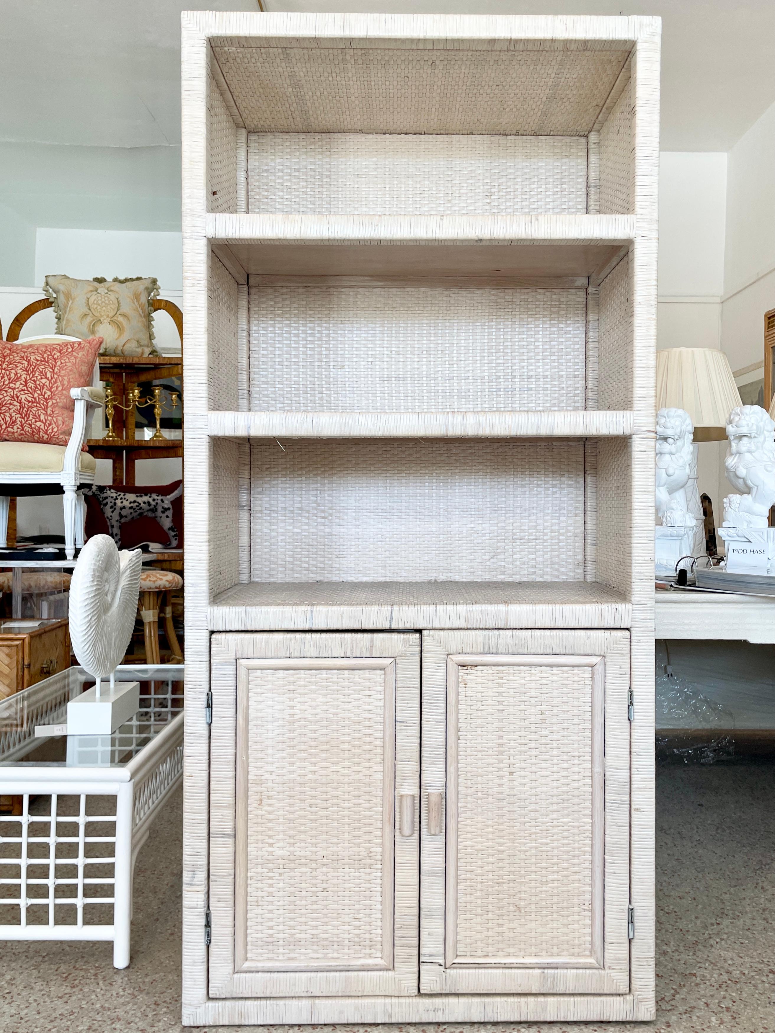Rare Bielecky Brothers white washed boho chic rattan etagere with shelves and lower cabinet. Great addition to your boho chic inspired home. See our matching Bielecky Brothers who washed furniture in our listing!