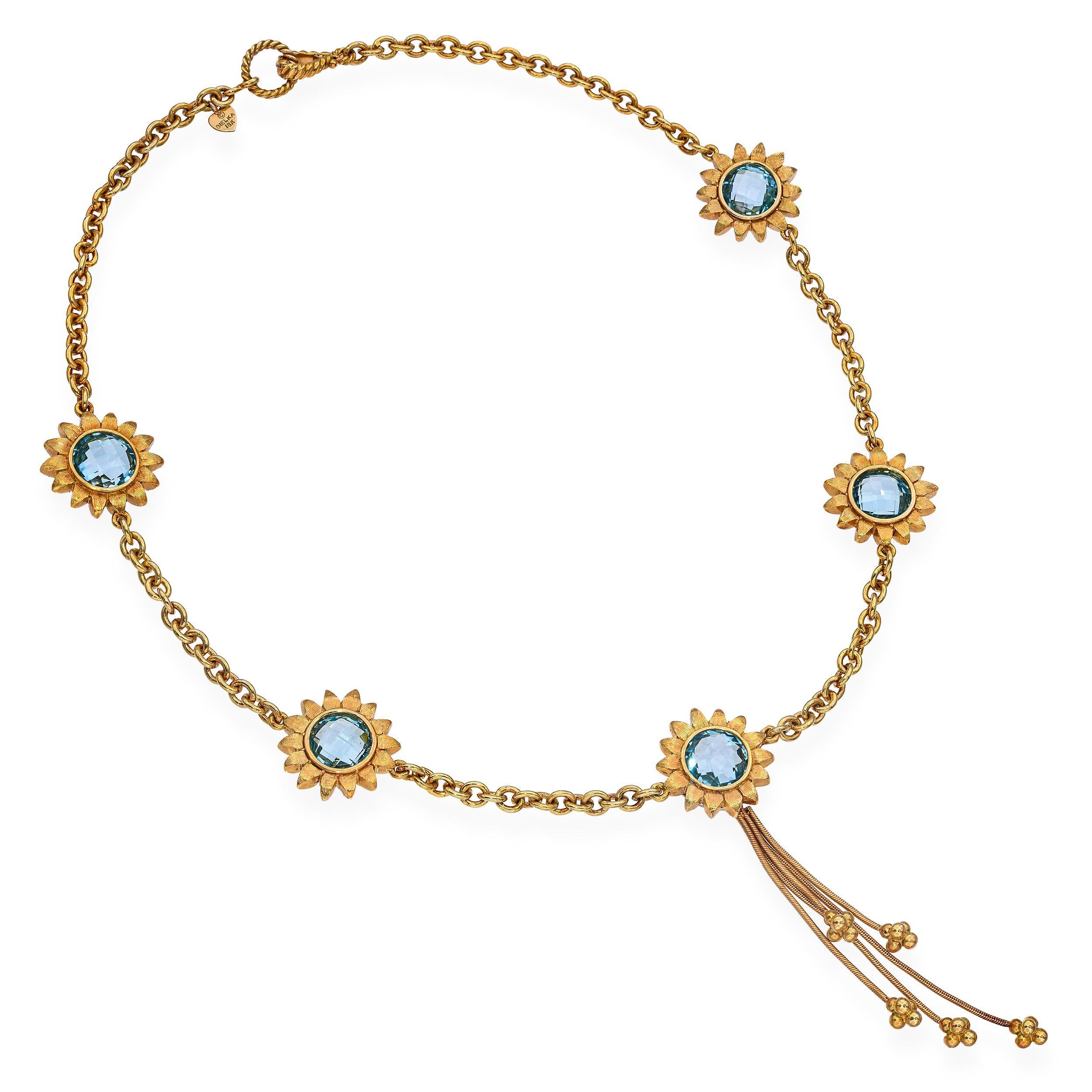 Célébrez la beauté de la Nature avec cet exquis collier de tournesols Bielka, finement réalisé en or jaune 18 carats. Au centre de la fleur de soleil rayonnante se trouve une topaze dorée brillante, rayonnante de chaleur et de lumière. Les pétales