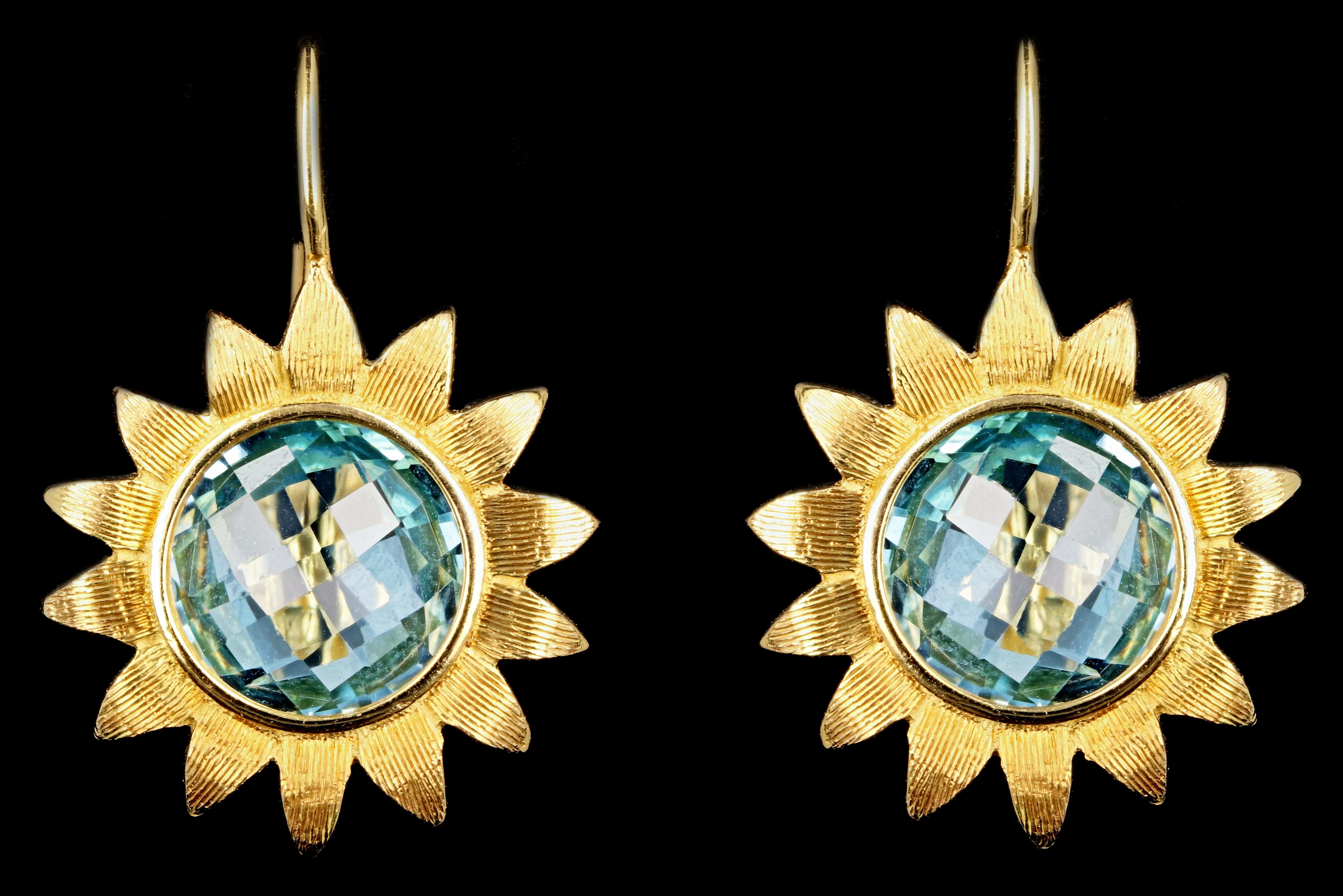 Designer: Bielka

Era: Modern

Composition: 18k yellow gold

Primary Stone: Briolette round cut blue topaz

Carat Weight: 6 carats total

Earring Weight: weighs 7.7 pennyweights

Earring Height: 20mm

Earring Length: 15mm

