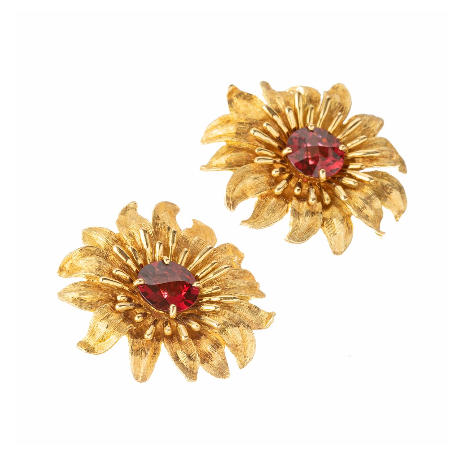 Handcrafted by Robert Bruce Bielka in the late 20th century, these large flower earrings are built in solid textured 18k yellow gold and each center a round faceted rhodolite garnet. Omega-style clip backs (posts may be added upon customer request).