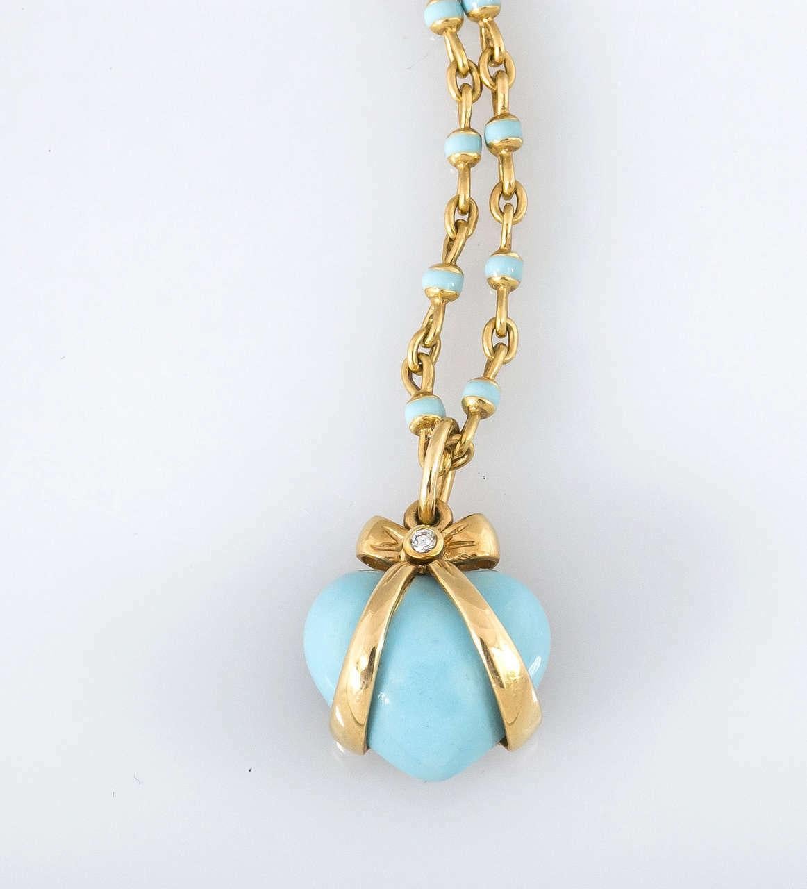 Bielka 18k yellow Gold & Turquoise Enamel Heart Pendant with diamonds

Turquoise enamel heart pendant, wrapped in an 18k yellow gold bow and accented by round-cut diamonds. Two diamonds weighing 0.02 total carats. Handcrafted in New York City.