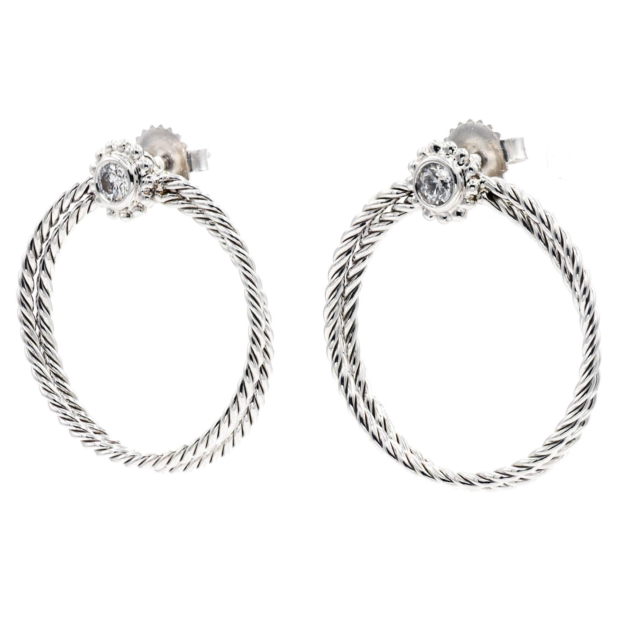 Bielka Diamond 18k white gold twisted wire hoop earrings with .30cts total of bright sparkly Diamonds.

2 round full cut Diamonds, approx. total weight .30cts, F, VS
18k white gold
Tested and stamped: 18k
Hallmark: Bielka
8.3 grams
Top to bottom: