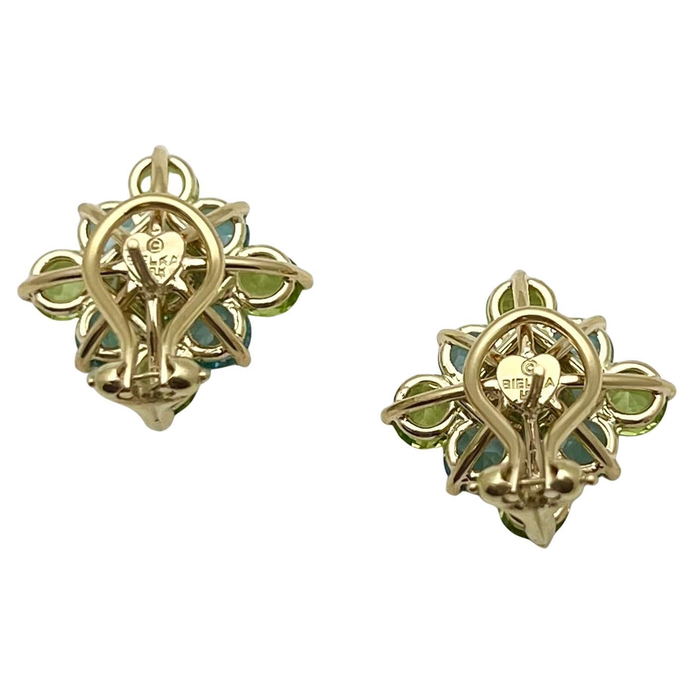 Square-shaped peridot and blue topaz checkerboard-style cluster earrings.  Handmade in 18k yellow gold.  Set with ten round-cut peridot and eight round-cut blue topaz.  Pierced posts with omega clip backs.  Designed by Robert Bielka.  0.84