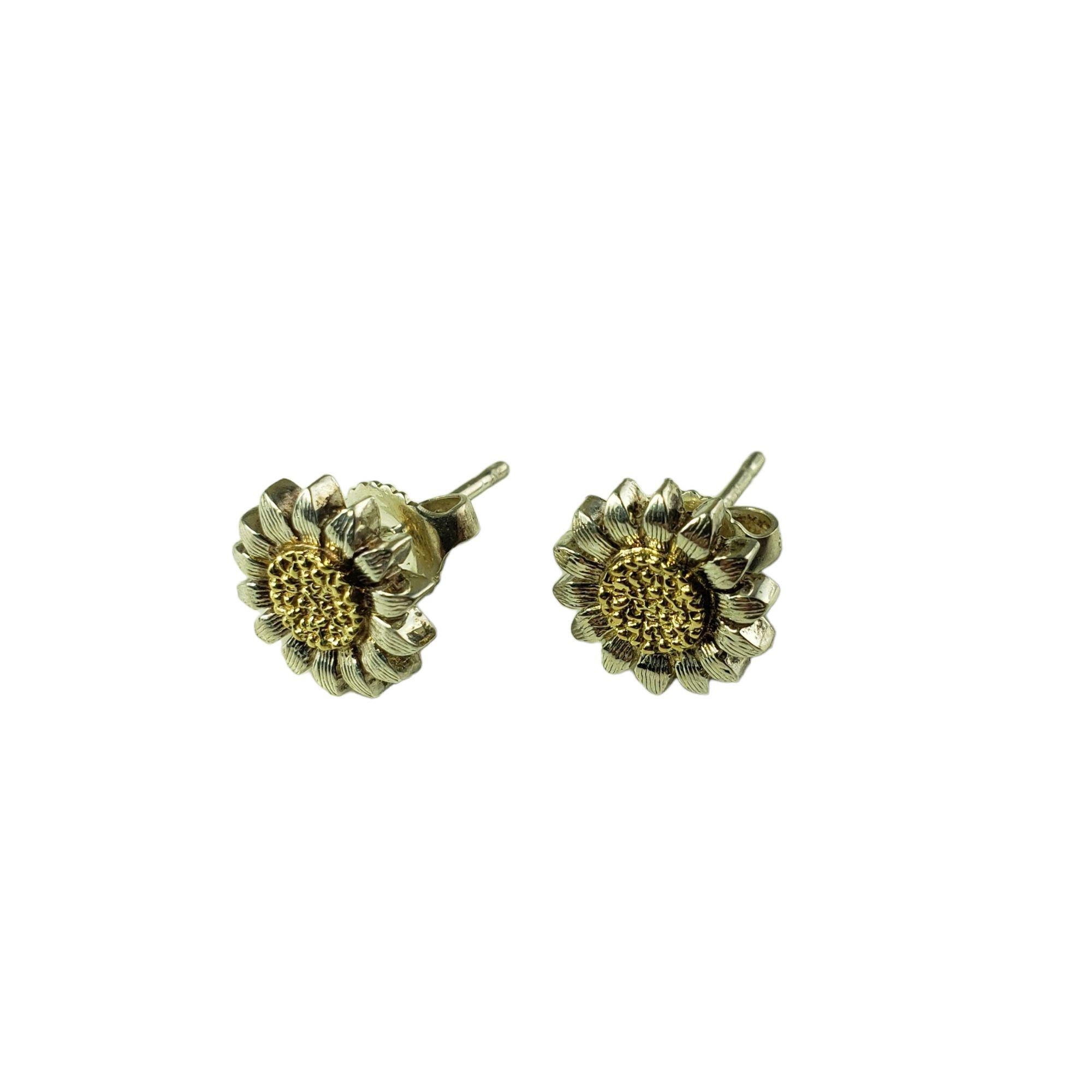 Bielka Sterling Silver and 18 Karat Yellow Gold Sunflower Earrings-

These lovely sunflower earrings are crafted in meticulously detailed sterling silver and 18K yellow gold.

Size: 10 mm

Weight: 2.9 gr./ 1.8 dwt.

Stamped: Sterling 18K RBB

Very
