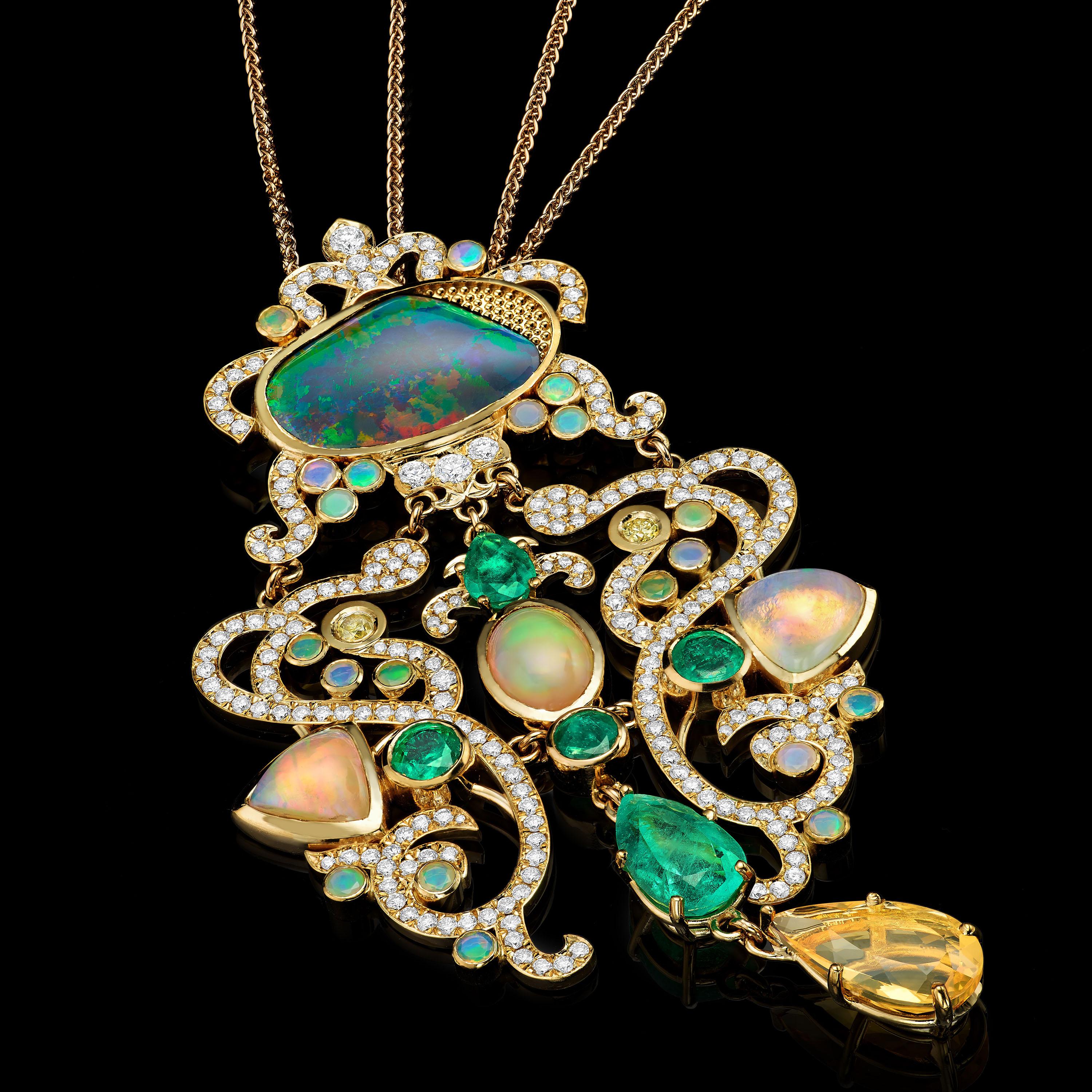 Bifrost pendant in 18K gold set with diamonds (5.0 ctw), emeralds (5.23ctw), and three kinds of opals (Australian, Ethiopian, and Mexican 15ctw). 

Bifrost is an Old Norse term that means a shimmering path to heaven. Often thought to be a reference