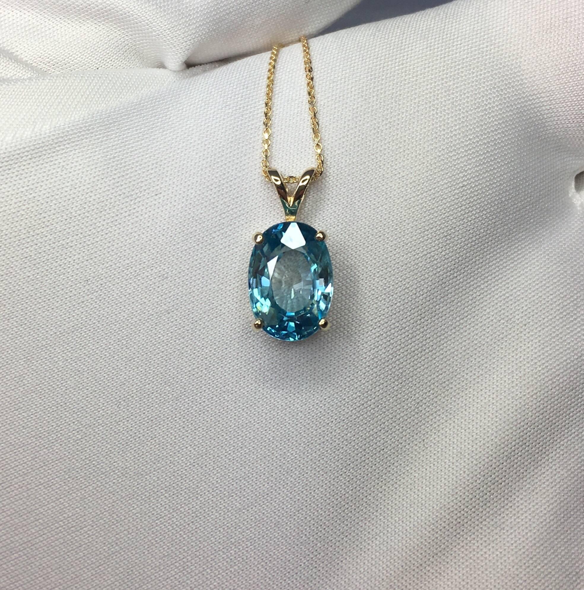 Beautiful natural large 5.40 carat blue zircon.
Set in a fine 14k yellow gold solitaire pendant.

Stunning blue zircon with a vivid neon blue colour and excellent clarity, practically flawless.

It also has an excellent oval cut which shows lots of