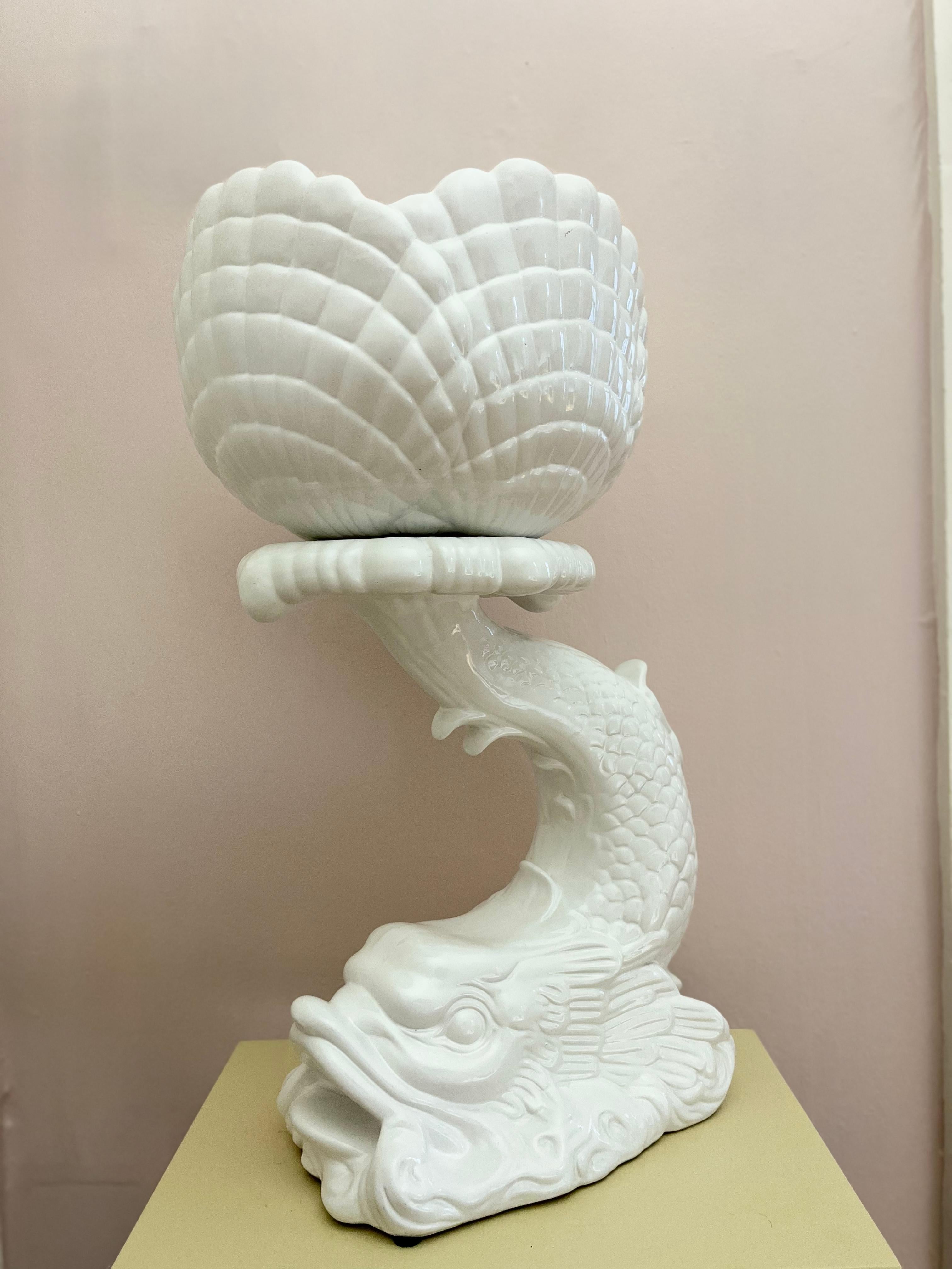Not for the minimalist, this crazy, detailed, decorative porcelain planter / plant stand is big, both in size and presence. Unsigned, but found in Paris, so it's probably French. In the shape of a dragon-like fish, open mouth and all. Very detailed,