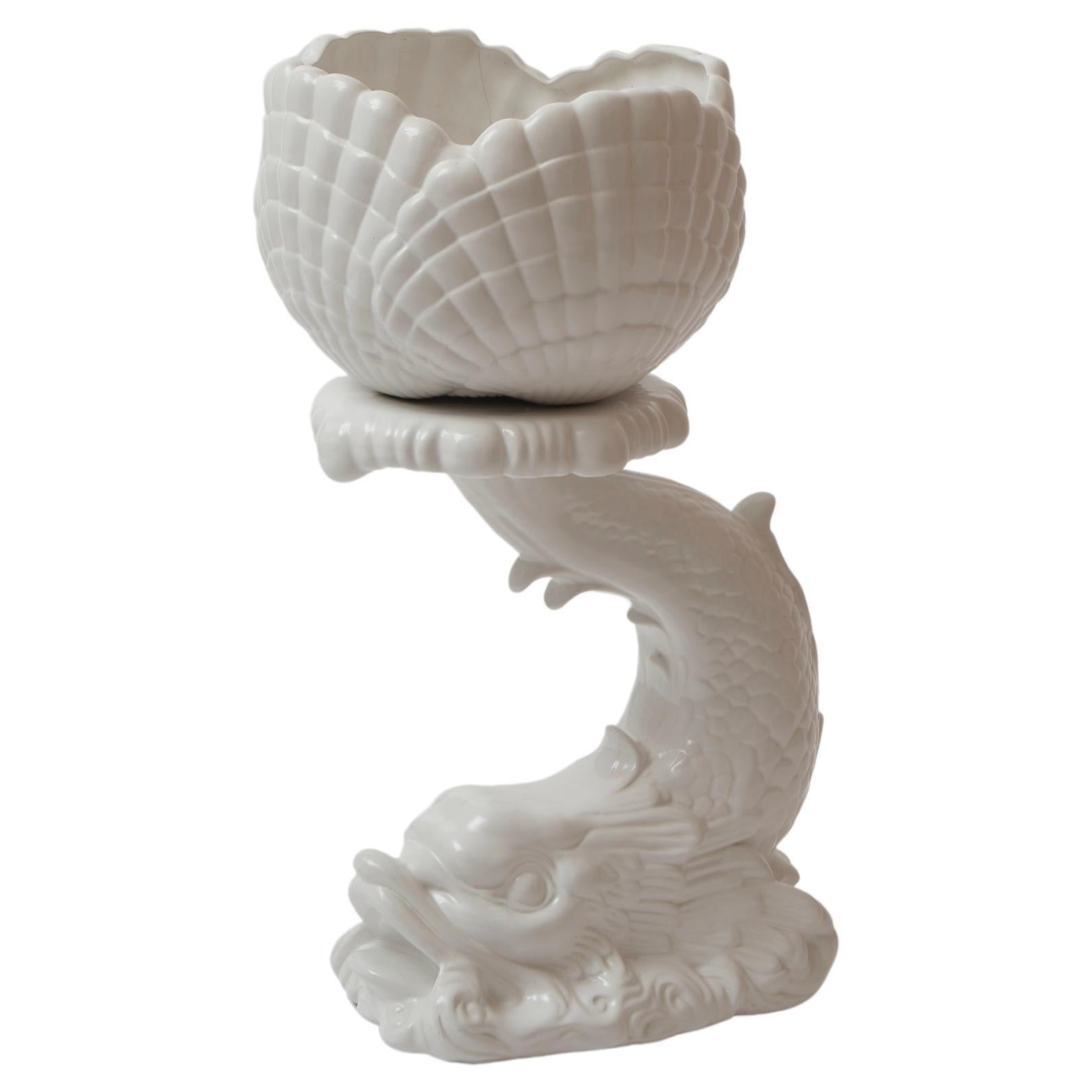 Big and crazy porcelain plant stand in the shape of a dragonish fish