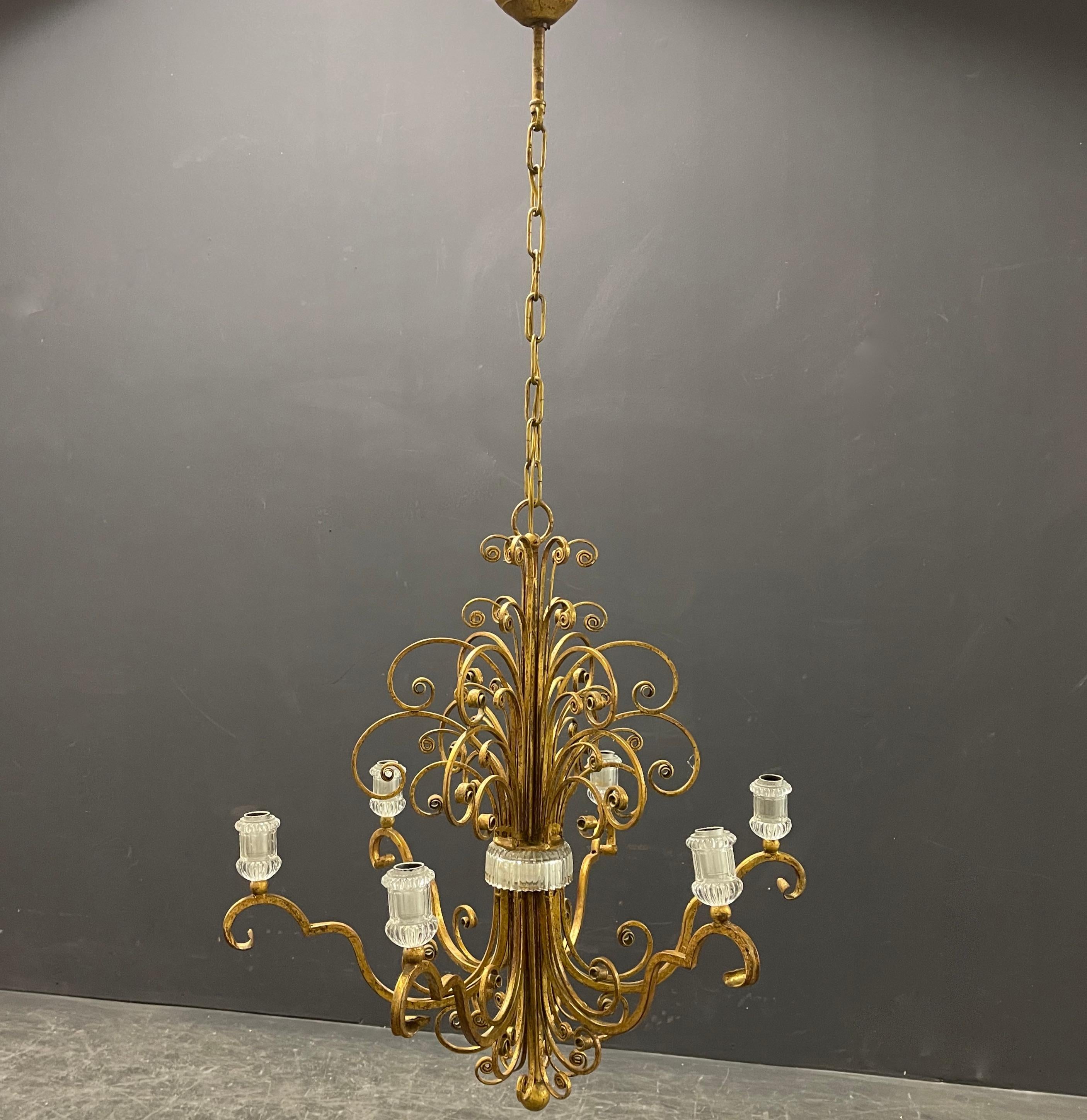 metallo e vetro di Giltet. sono disponibili scansie da parete abbinate. il più grande lampadario di Maison Bagues che abbiamo avuto finora....