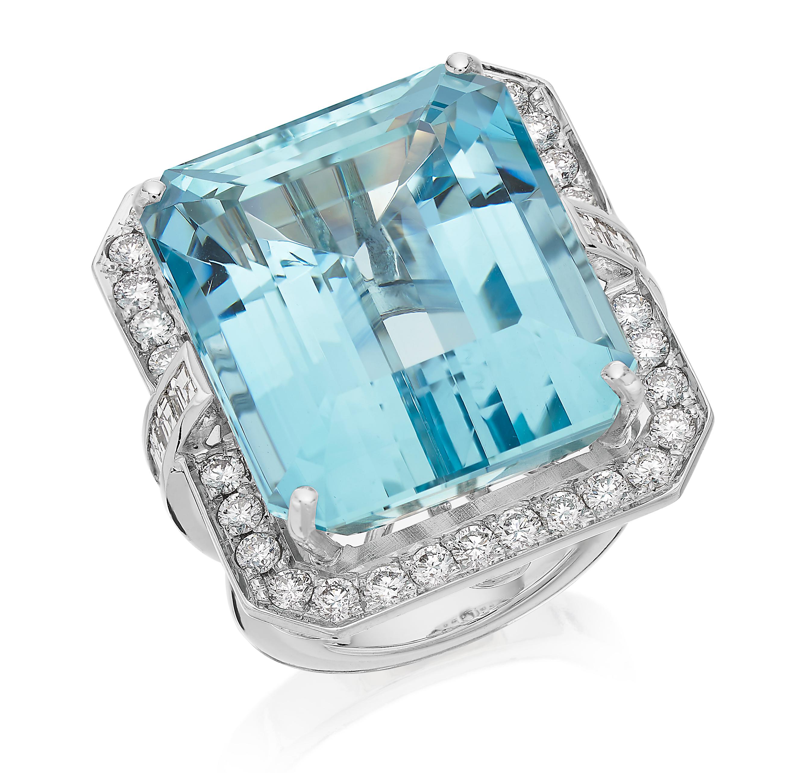 Undeniably beautiful 18K gold, diamond and aquamarine statement ring. Centering big emerald cut aquamarine, and the stone is very good clarity and so clear that you can see through it. British hallmarked, town London 18k gold 2016, sponsor mark