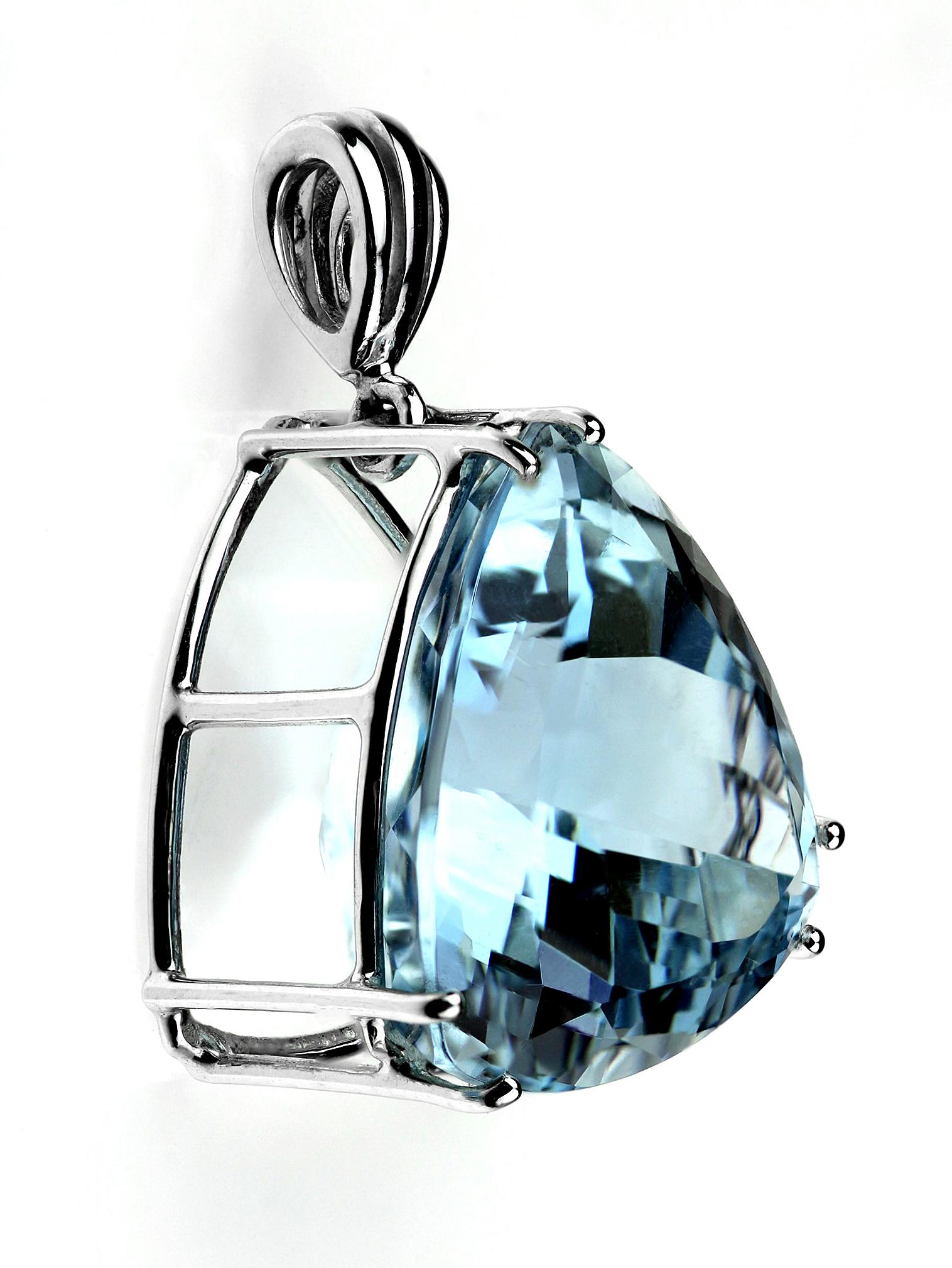 Triangular aquamarine in simple platinum setting which perfectly showing the shades of blue green colour. 
1 x aquamarine, approximate weight 25.0 carats 