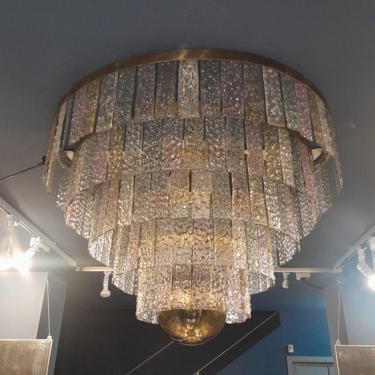 Angelo Lelii founder of the large lighting company in the 1950s helped reform and revolutionize the world of modern lighting.
This is one of the rarest and most beautiful chandeliers ever made, the entire structure is made of brass and has glass of