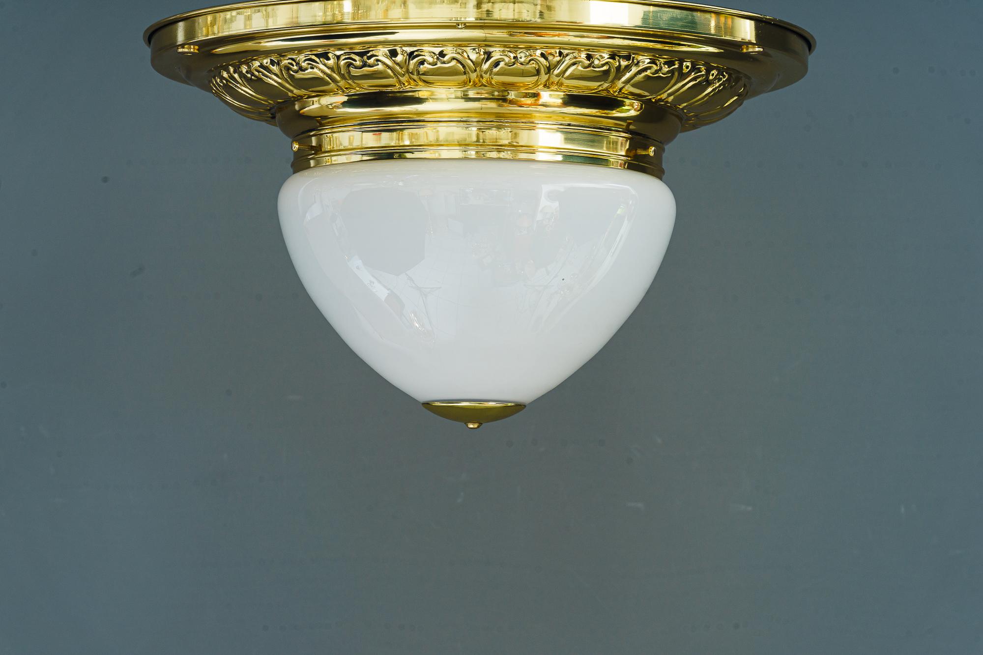 Big art deco ceiling lamp vienna around 1920s
Brass polished and stove enameled
Original antique glass shade
