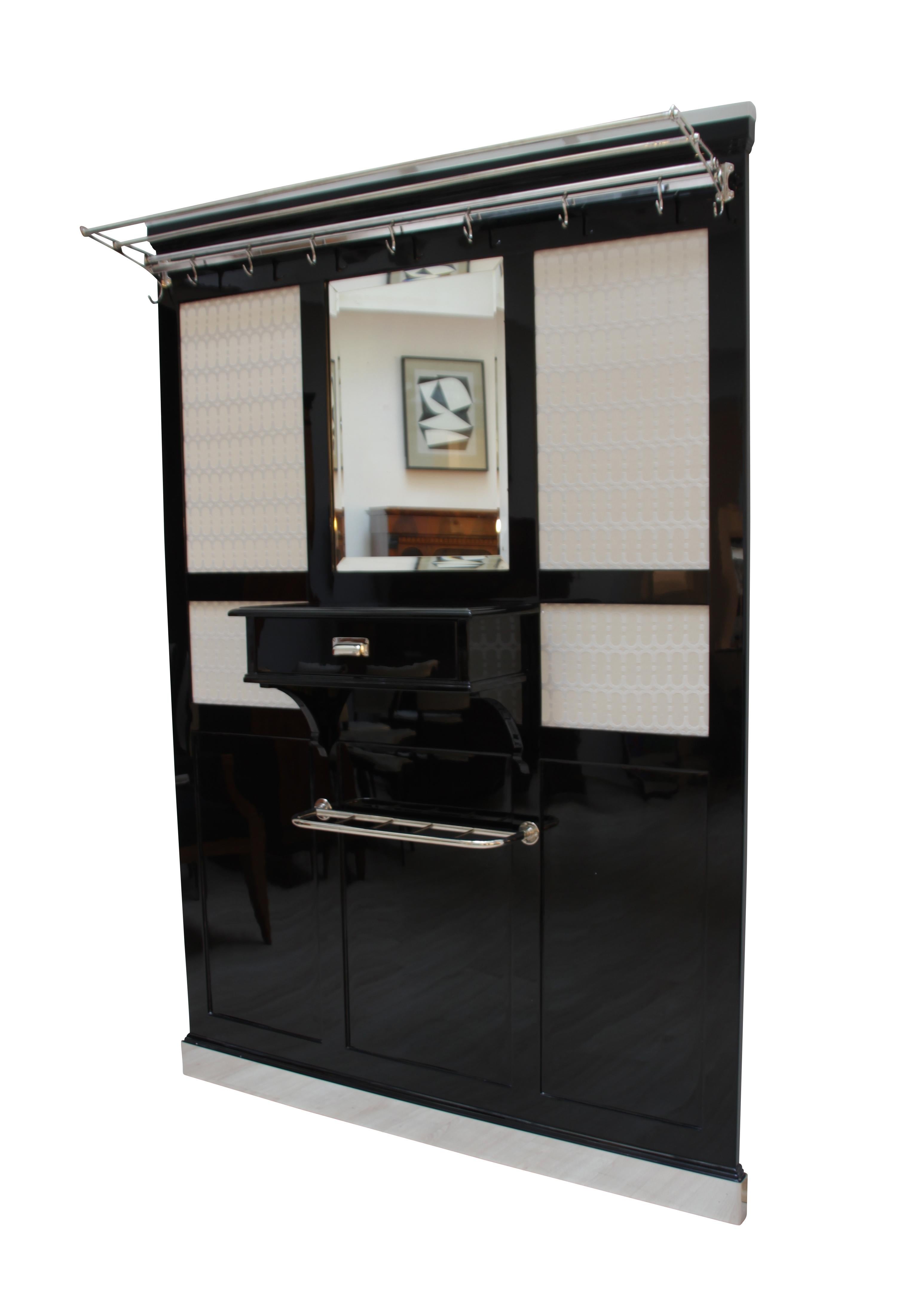 Very exclusive, big and functional Art Deco wardrobe

Black lacquered oak solid wood. Lacquered with polyurethane and high-gloss polished.

The wardrobe has one drawer and several original and newly galvanized steel tubes and metal trims.

Original