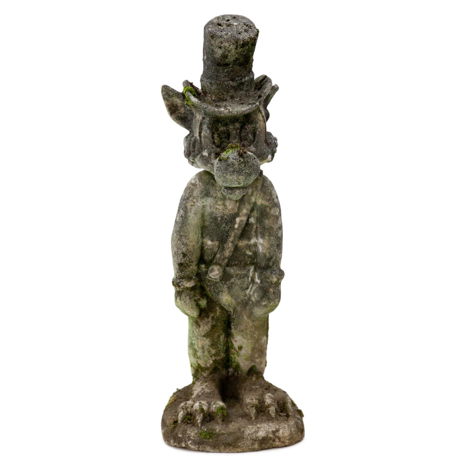 Cast stone sculpture of the big bad wolf of Walt Disney’s Three Little Pig, wearing a dungaree and a top hat. Very beautiful, natural patina, parts of the nose are missing.