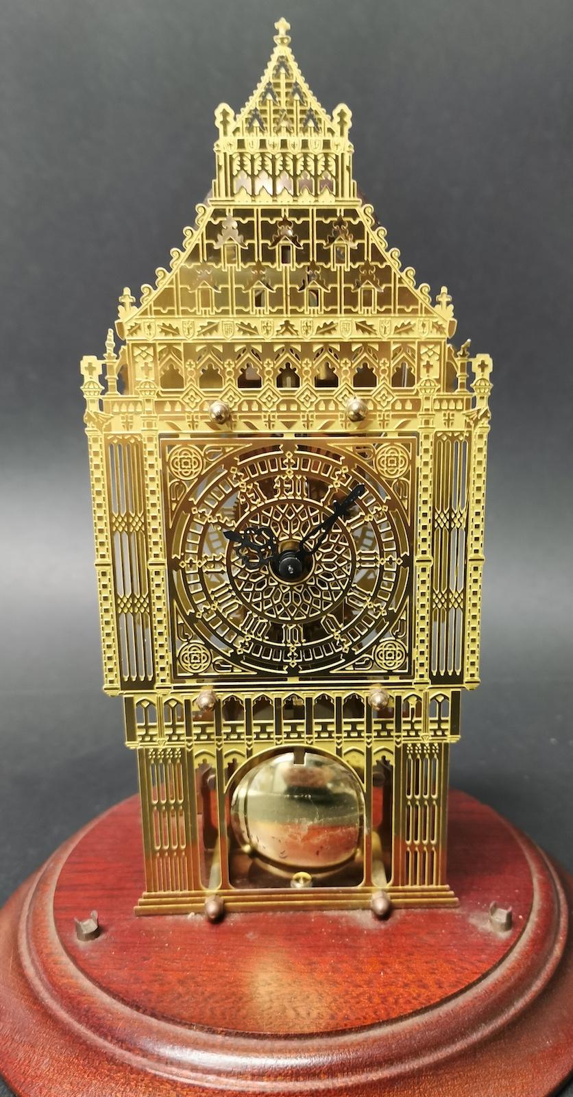 Big ben brass skeleton clock in a glass dome,
chimes on hours,
the glass dome measures: 20 x 30cm high.