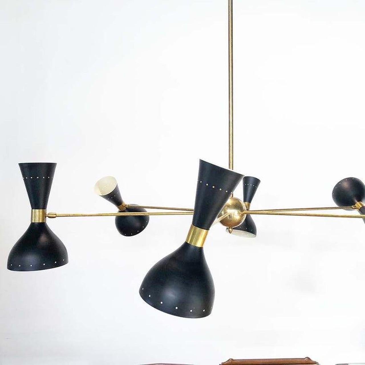 Big black chandelier stilnovo - design -

Materials: brass, metal 

Measurements: cm 120 x cm 100 H.