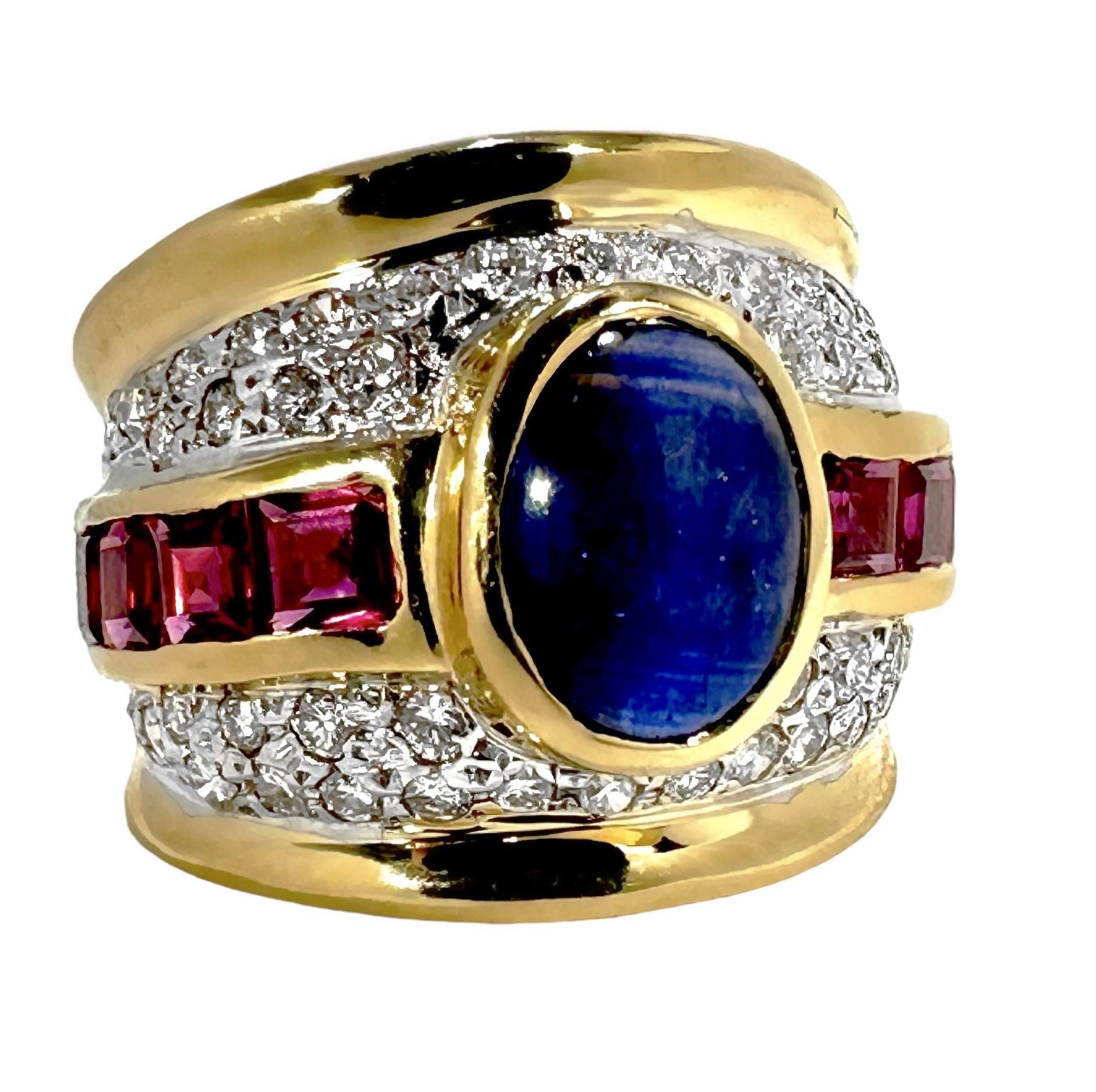 This bold 14k yellow gold vintage cocktail ring embodies the spirit and iconic styling cues of the 1970's.
The bezel set, oval shaped, rich blue, natural sapphire cabochon, in the center, weighs approximately 2.60ct. Flanking the sapphire are two