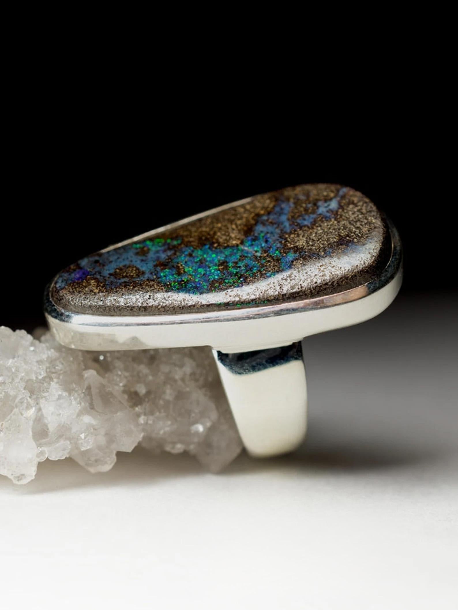 Big silver ring with natural Boulder Opal 
gemstone origin - Australia
gemstone weight - 23.40 carat
ring weight - 12.39 grams
ring size - 7.5 US 
gemstone size - 0.2 х 0.67 x 1.34 in / 5 х 17 х 34 mm