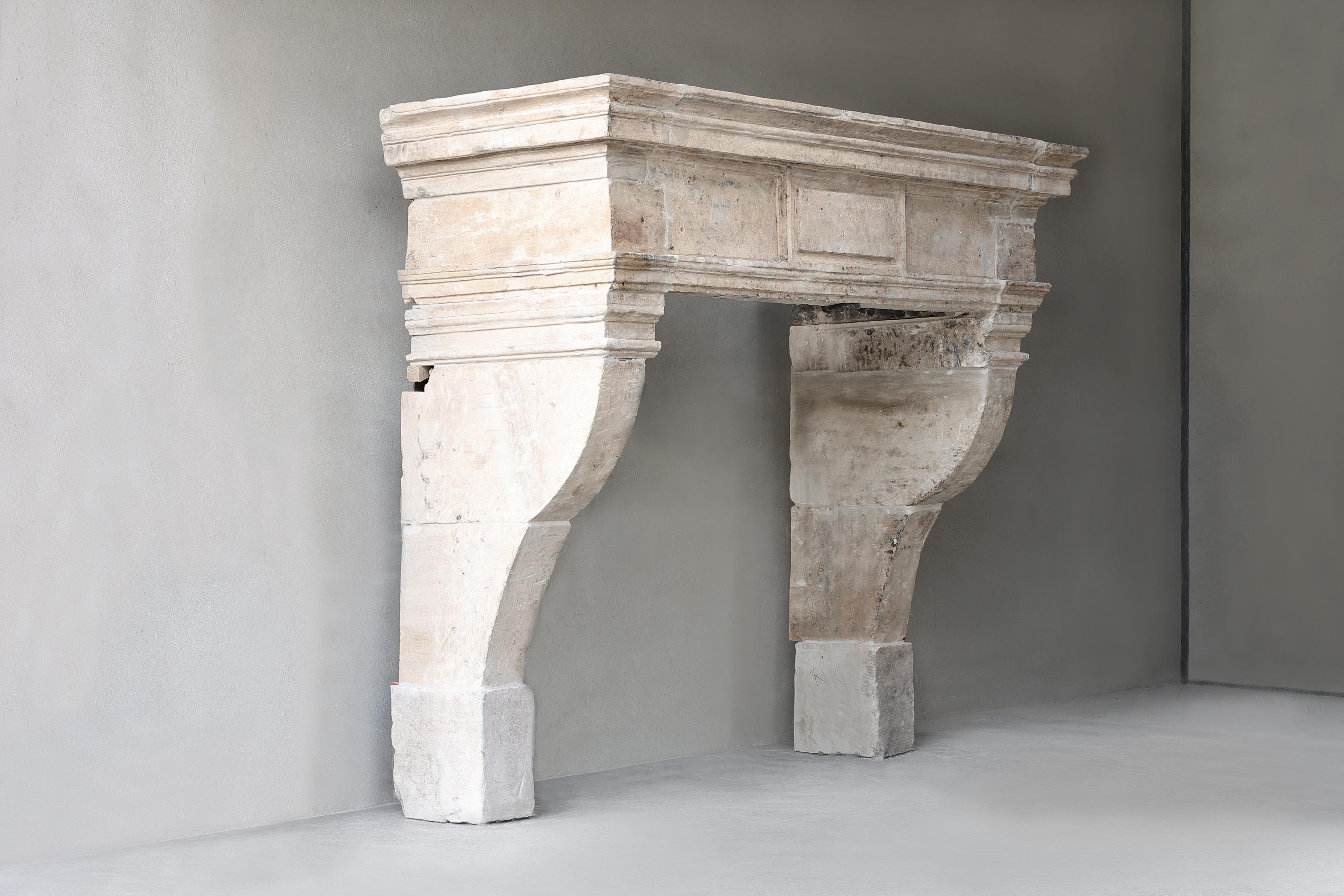 Very impressive antique castle fireplace from the 19th century in style of Louis XIII! A robust fireplace with charisma and allure. This fireplace made of French limestone has a beautiful ornament in the middle of the front section and beautiful
